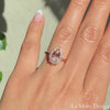 This truly unique and stunning morganite engagement ring is crafted in 14k rose gold Tiara Halo Diamond ring setting with a large 1.73-carat pear cut natural peach morganite center ~ total gemstone and diamond weight of the whole ring is 2.18 ct.tw.  This one-of-a-kind pear-cut engagement ring is perfect for brides looking for diamond alternative engagement rings! All our wedding bands can pair beautifully with this gorgeous halo diamond morganite ring!