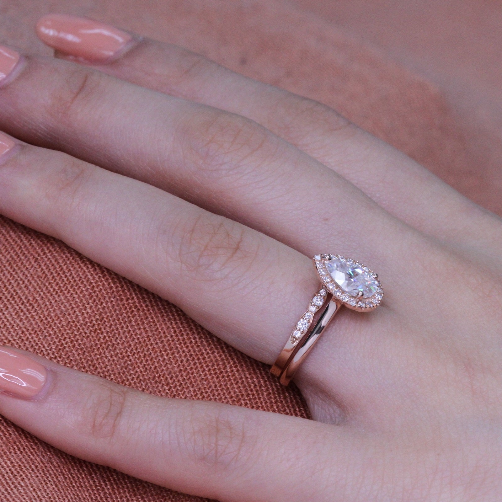 rose gold halo bridal set pear moissanite ring and scalloped diamond band by la more design
