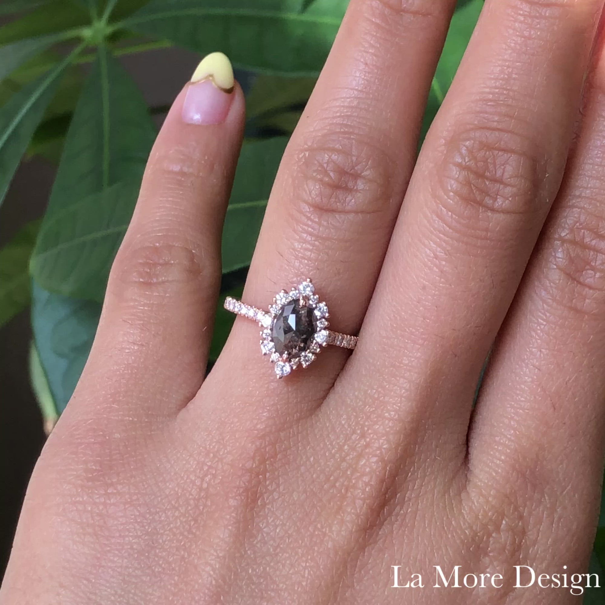 Breathtakingly stunning salt and pepper diamond engagement ring is crafted in the 14k rose gold tiara halo diamond ring setting with a 0.95-carat marquise-shaped rose cut natural grey diamond center ~ the total diamond weight of the whole ring is 1.43 ct.tw.  