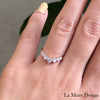 This luminous large diamond ring sparkles from every angle! The curved wedding band showcases seven round brilliant cut diamonds set beautifully in 14k rose gold. This timelessly elegant design of 7 stone diamond wedding ring is finished in a curved band for a breathtakingly stunning effect! This large 7 stone diamond wedding band can nest perfectly with most of our engagement rings as a bridal set or trio wedding set. 