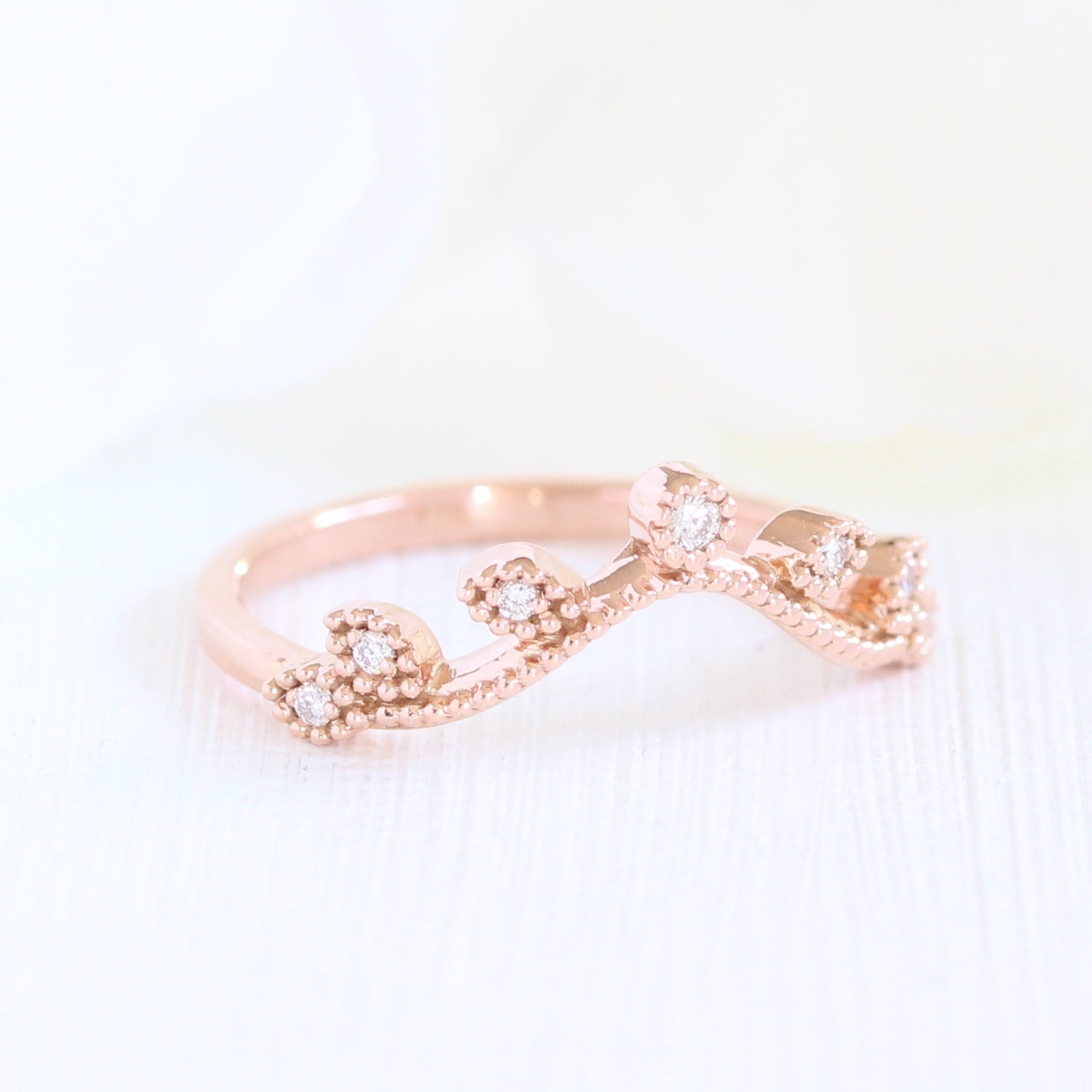 curved diamond wedding ring in rose gold leaf band by la more design