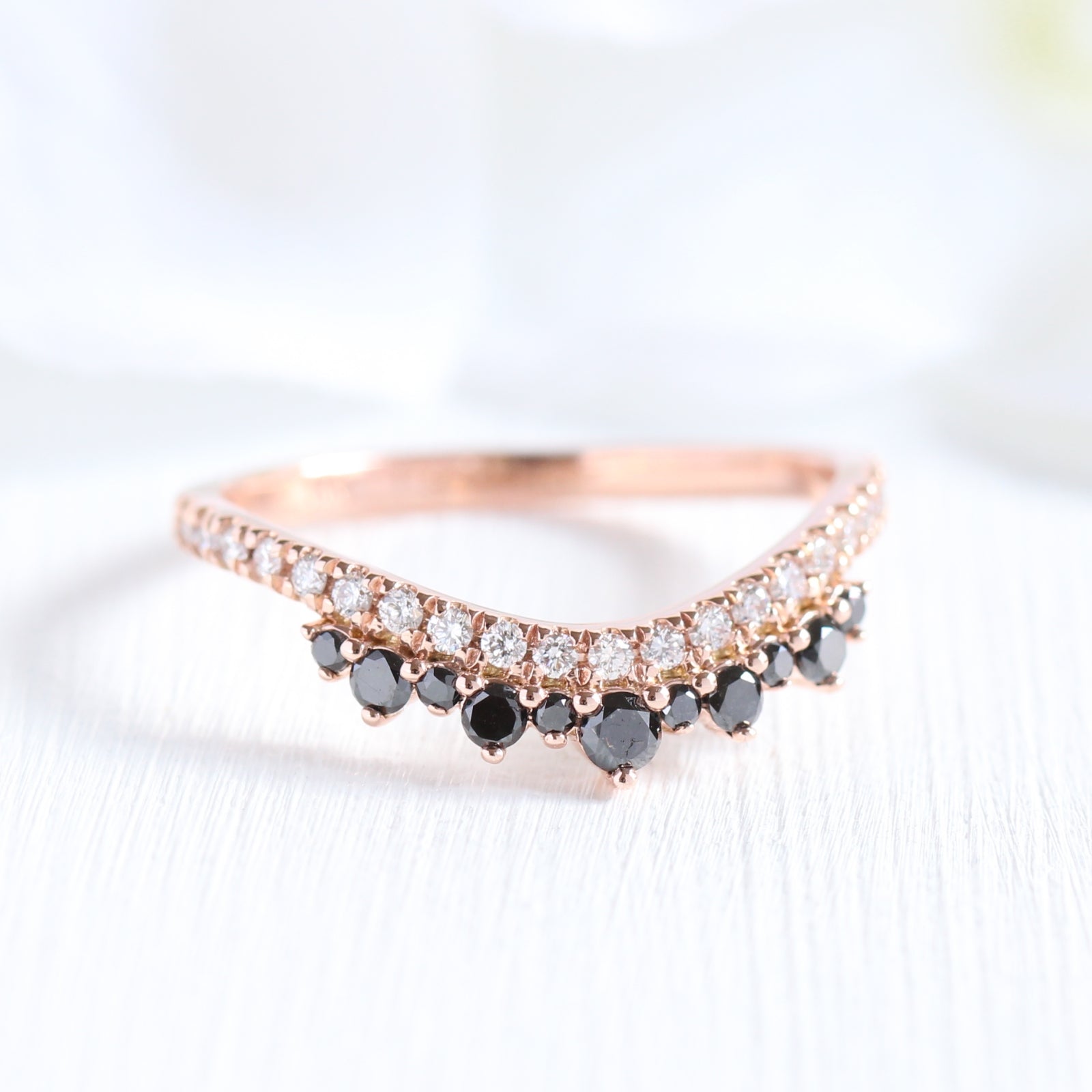 curved wedding band with black and white diamond in rose gold crown band by la more design jewelry