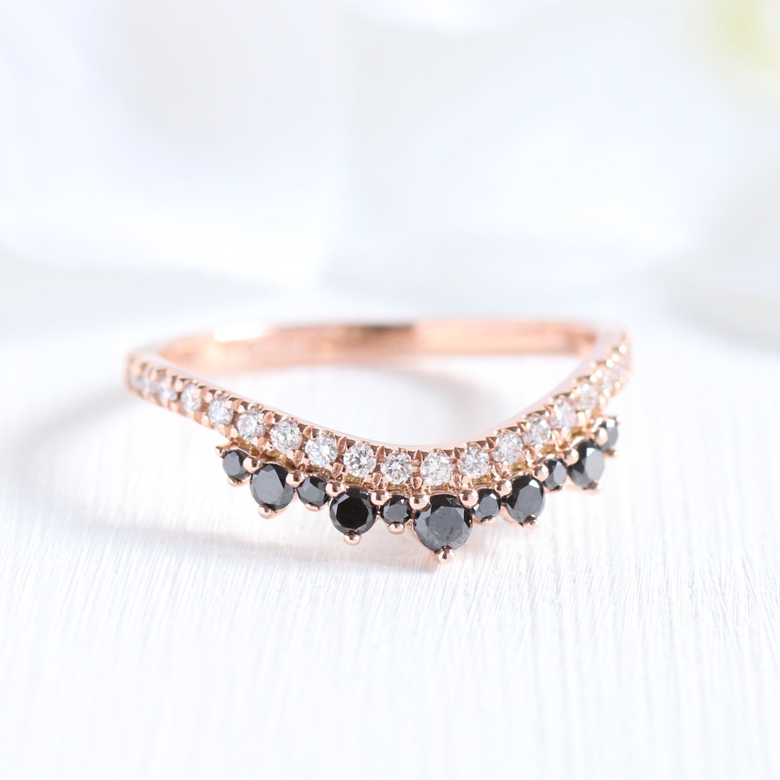 curved wedding band with black and white diamond in rose gold crown band by la more design