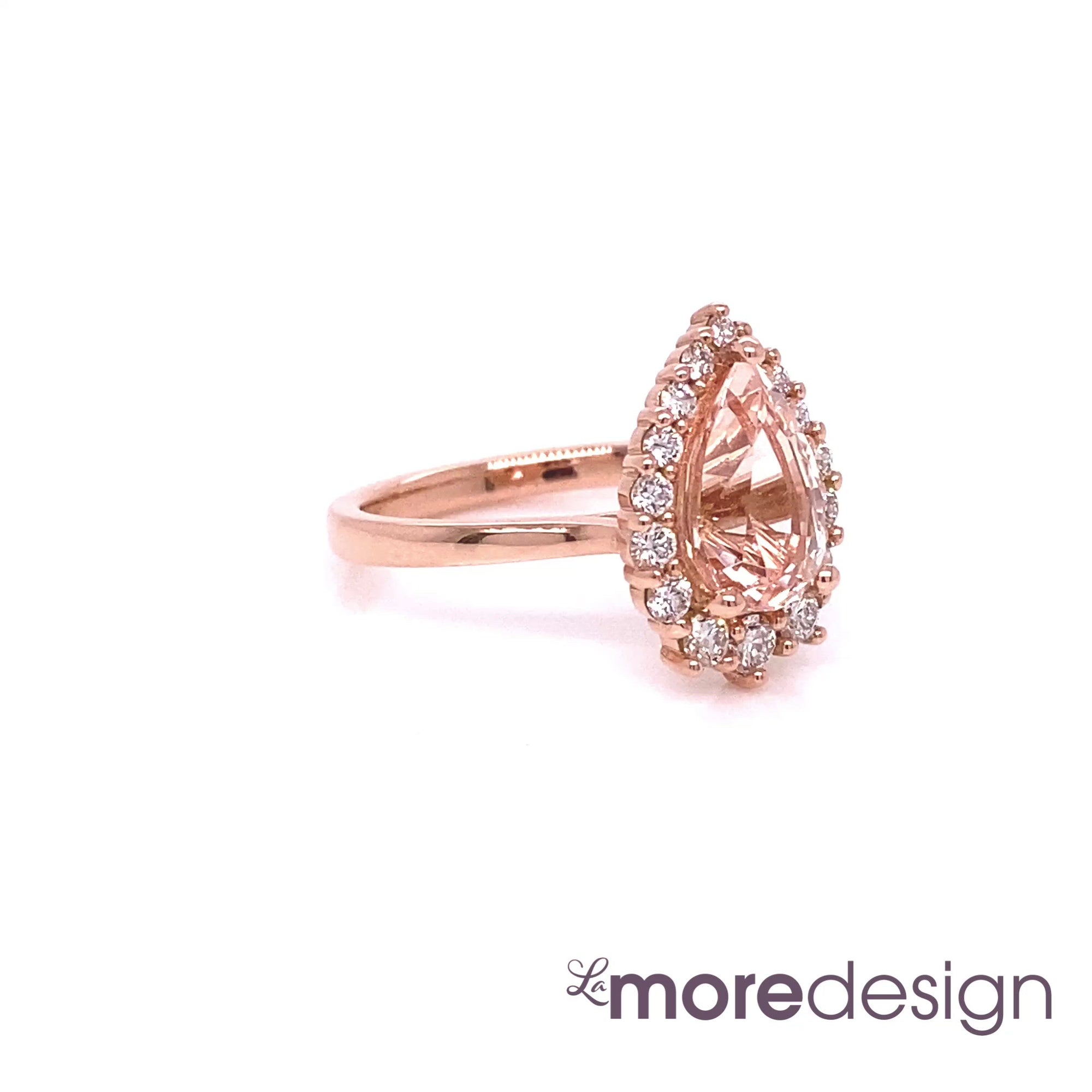 This truly unique and stunning morganite engagement ring is crafted in 14k rose gold Tiara Halo Diamond ring setting with a large 1.73-carat pear cut natural peach morganite center ~ total gemstone and diamond weight of the whole ring is 2.18 ct.tw.  This one-of-a-kind pear-cut engagement ring is perfect for brides looking for diamond alternative engagement rings! All our wedding bands can pair beautifully with this gorgeous halo diamond morganite ring!