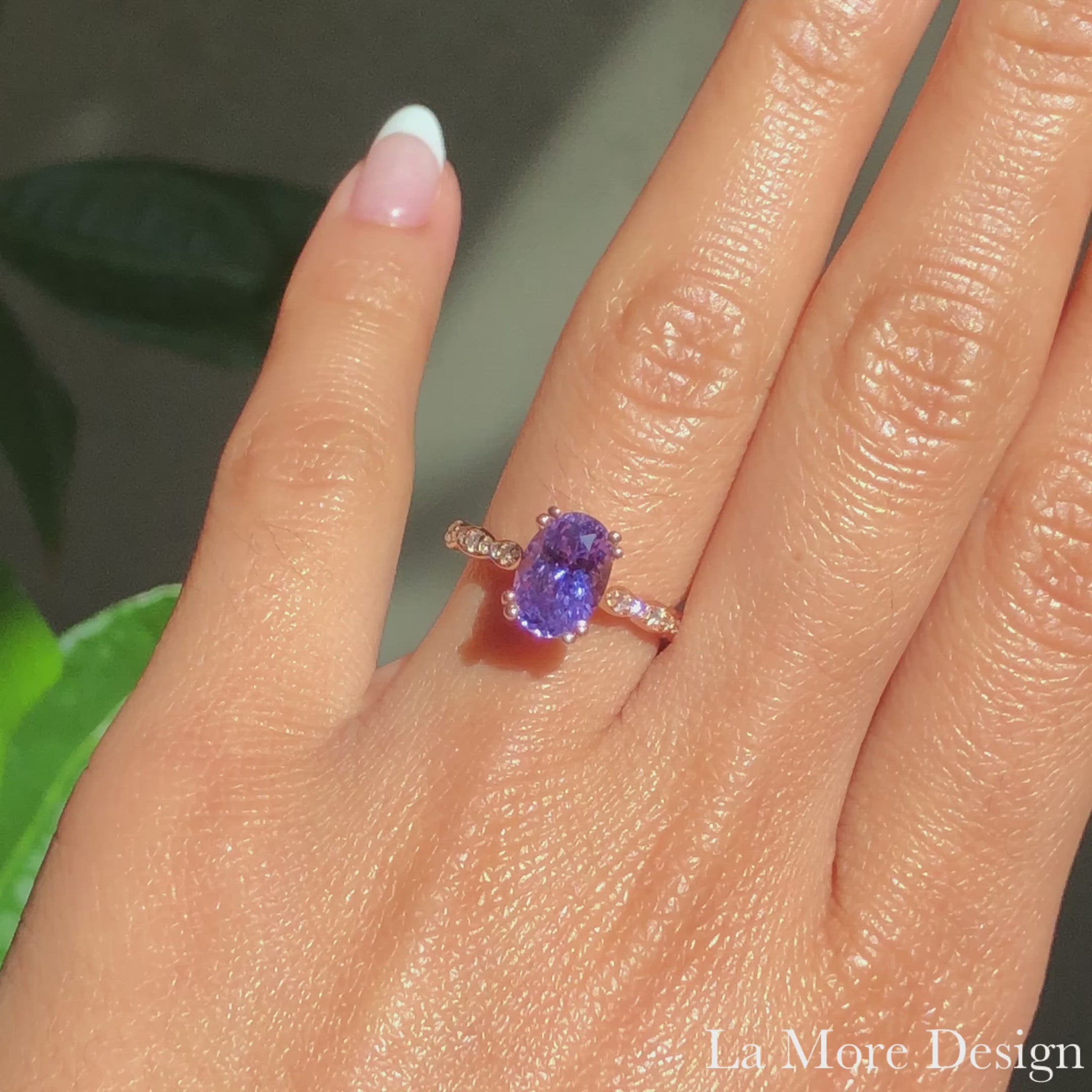 This breaktakingly stunning purple sapphire engagement ring is crafted in 14k rose gold Grace Solitaire ring setting with a large 2.58-carat oval cut natural purple sapphire center and is finished in our signature scalloped diamond band to complete the look ~ total gemstone and diamond weight of the whole ring is 2.78 ct.tw.  This one-of-a-kind sapphire ring is perfect for brides looking for non-traditional engagement rings. All our wedding bands can pair beautifully with this gorgeous solitaire sapphire ri