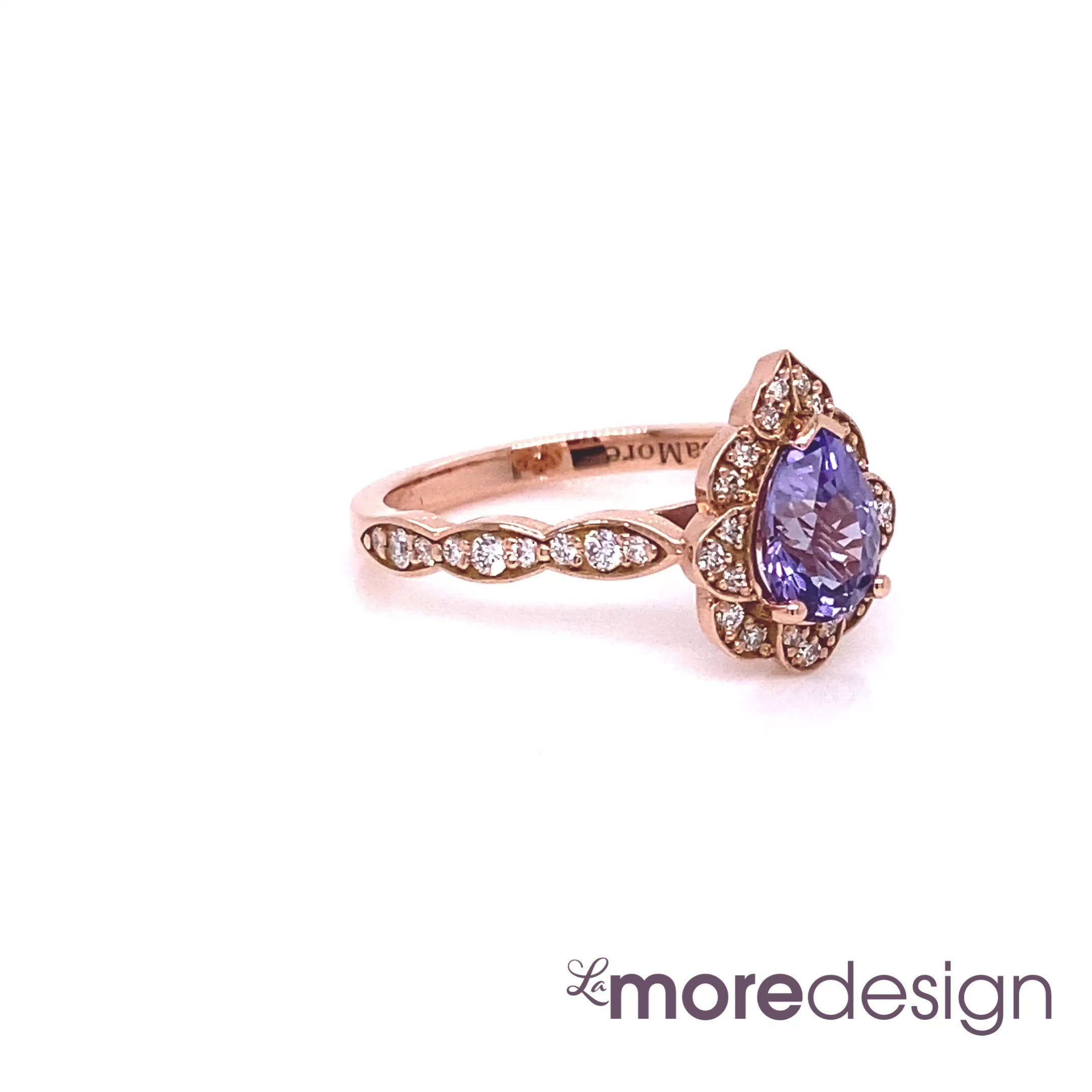 This breathtakingly gorgeous sapphire engagement ring is crafted in 14k rose gold vintage floral diamond ring setting with a 1.25-carat pear cut natural lavender purple sapphire center ~ total gemstone and diamond weight of the whole ring is 1.57 ct.tw.  This unique yet elegant vintage-inspired pear cut engagement ring will guarantee a big smile on your future bride's face! All our wedding bands can pair beautifully with this gorgeous vintage floral diamond sapphire ring!