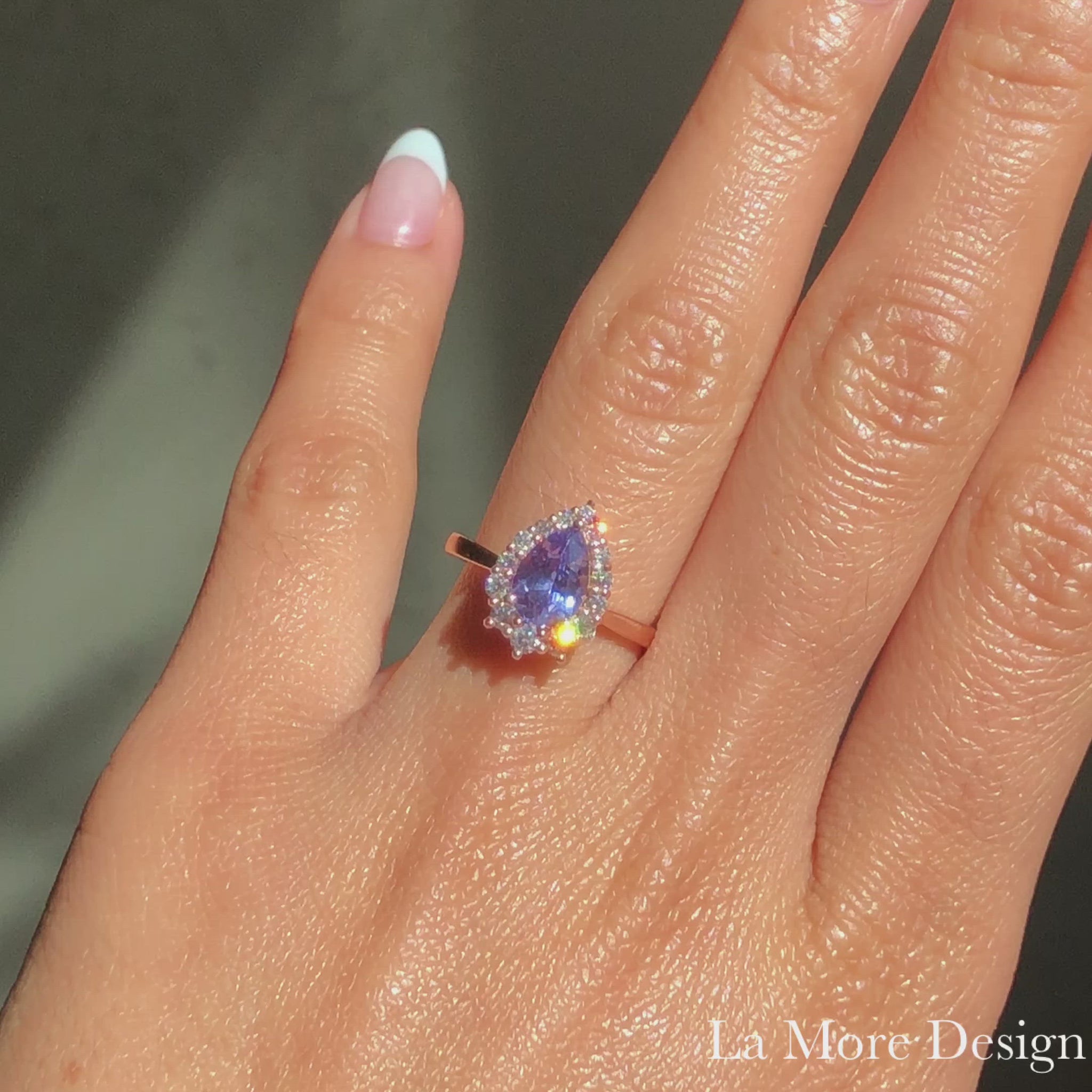 Simply stunning and elegant lavender sapphire engagement ring is crafted in 14k rose gold Tiara Halo Diamond ring setting with a 1.45-carat pear cut natural lavender purple sapphire center ~ total gemstone and diamond weight of the whole ring is 1.83 ct.tw.  This one-of-a-kind sapphire diamond ring is perfect for brides looking for diamond alternative engagement rings! All our wedding bands can pair beautifully with this gorgeous halo diamond sapphire ring!