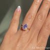 Simply stunning and elegant lavender sapphire engagement ring is crafted in 14k rose gold Tiara Halo Diamond ring setting with a 1.45-carat pear cut natural lavender purple sapphire center ~ total gemstone and diamond weight of the whole ring is 1.83 ct.tw.  This one-of-a-kind sapphire diamond ring is perfect for brides looking for diamond alternative engagement rings! All our wedding bands can pair beautifully with this gorgeous halo diamond sapphire ring!