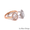 Artfully handcrafted rose gold and white gold halo engagement rings feature a 8x5mm pear cut forever one moissanite set in our Tiara Halo Diamond ring setting. The petite band gently tapers toward the moissanite center surrounded by brilliant white diamonds, creating a gorgeous feminine curve. This halo diamond moissanite ring is perfect for brides looking for a delicate yet unique tapered engagement ring. This pear shaped ring can be made in your choice of platinum or 14k or 18k yellow, rose or white gold.