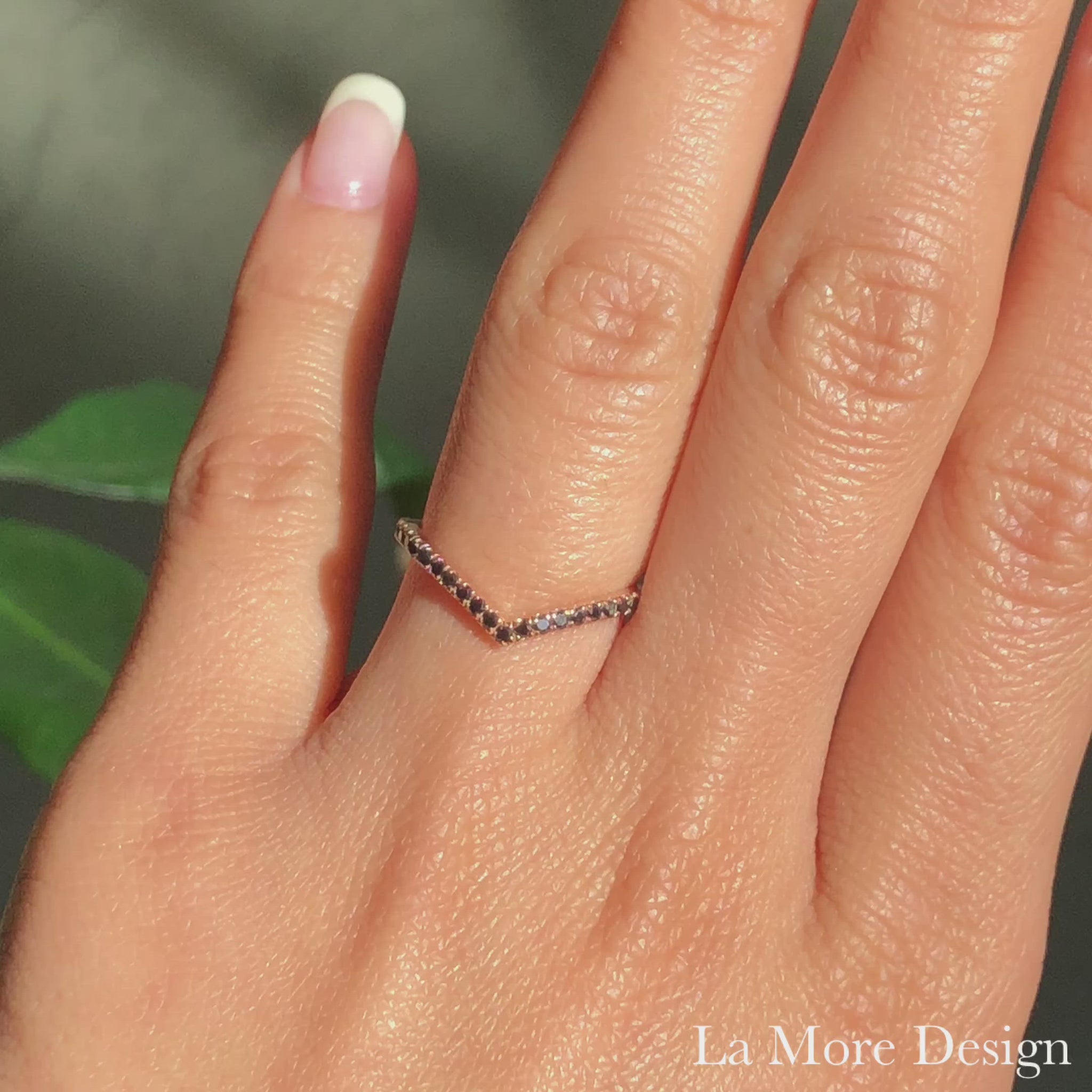 Elegant with a modern twist ~ this black diamond wedding ring is crafted in a 14k rose gold v-shaped chevron band. This unique curved diamond wedding band can nest perfectly with luna halo or tiara halo engagement rings, or it can stack up beautifully with your other rings. 