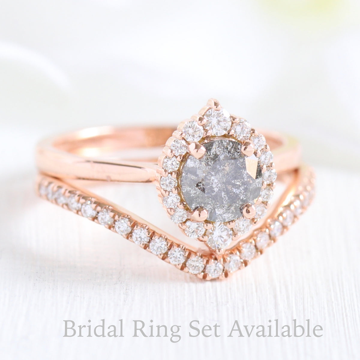 salt and pepper grey diamond ring and curved diamond wedding band in rose gold halo bridal ring set by la more design jewelry