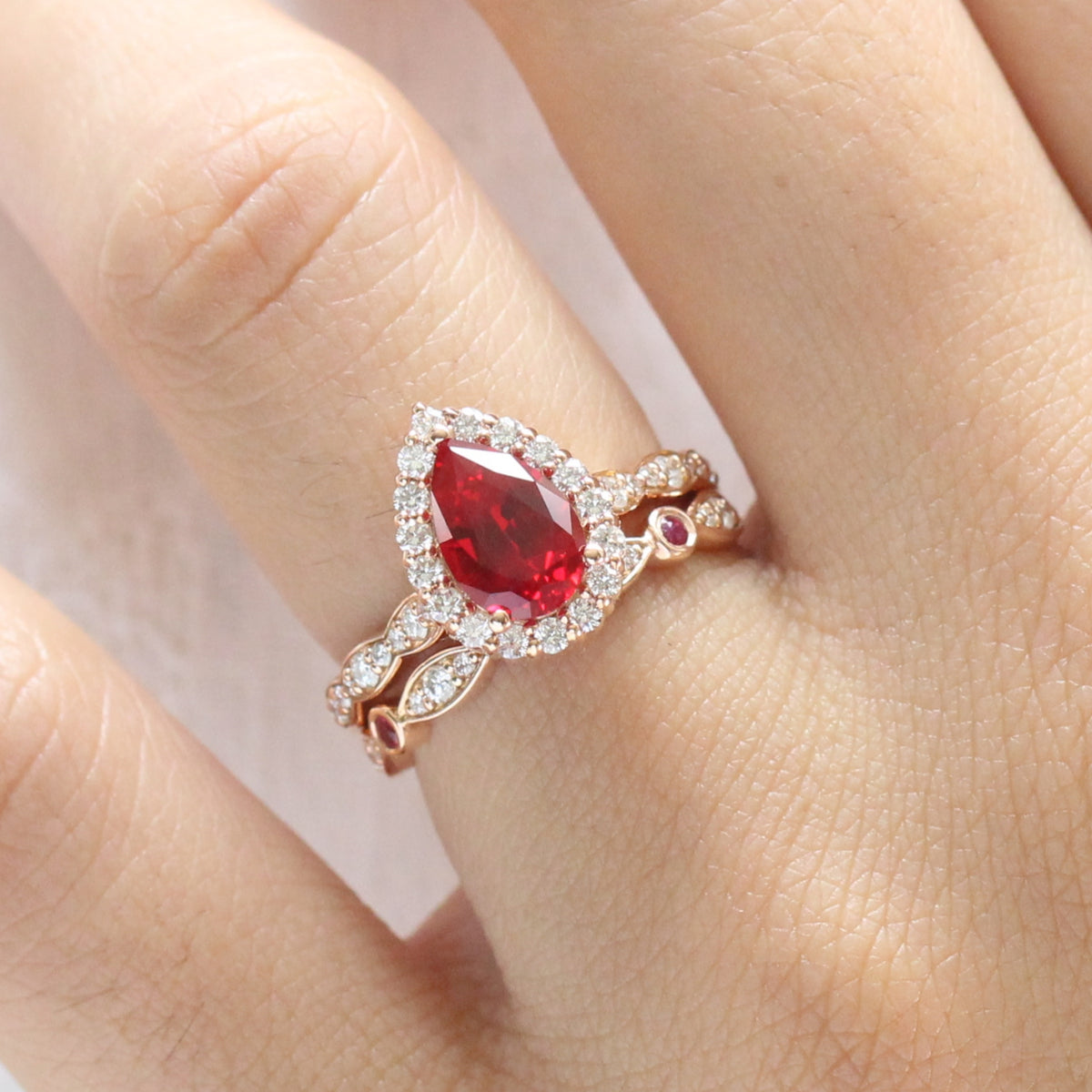 halo diamond pear ruby engagement ring rose gold bridal set ruby diamond wedding band by la more design jewelry