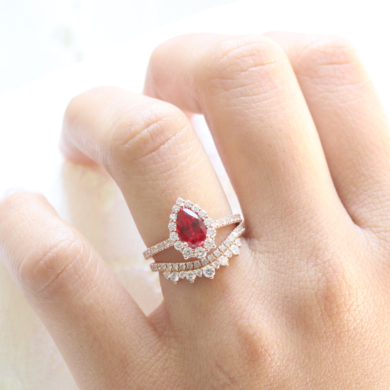 halo diamond ruby engagement ring bridal set rose gold and curved crown diamond wedding band by la more design jewelry