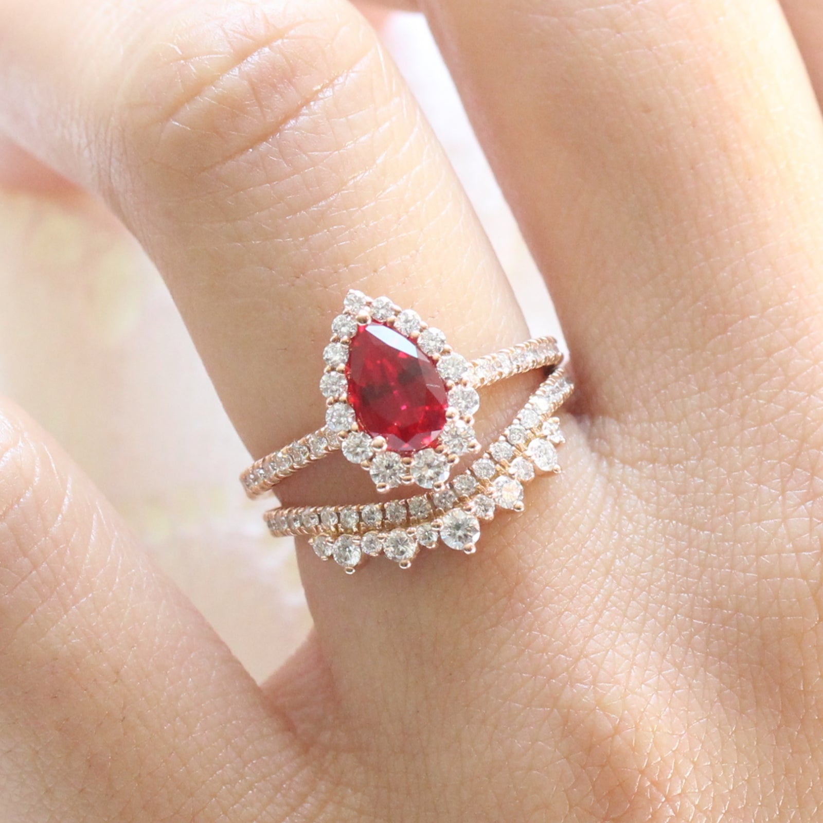 halo diamond ruby engagement ring bridal set rose gold and curved crown diamond wedding band by la more design jewelry