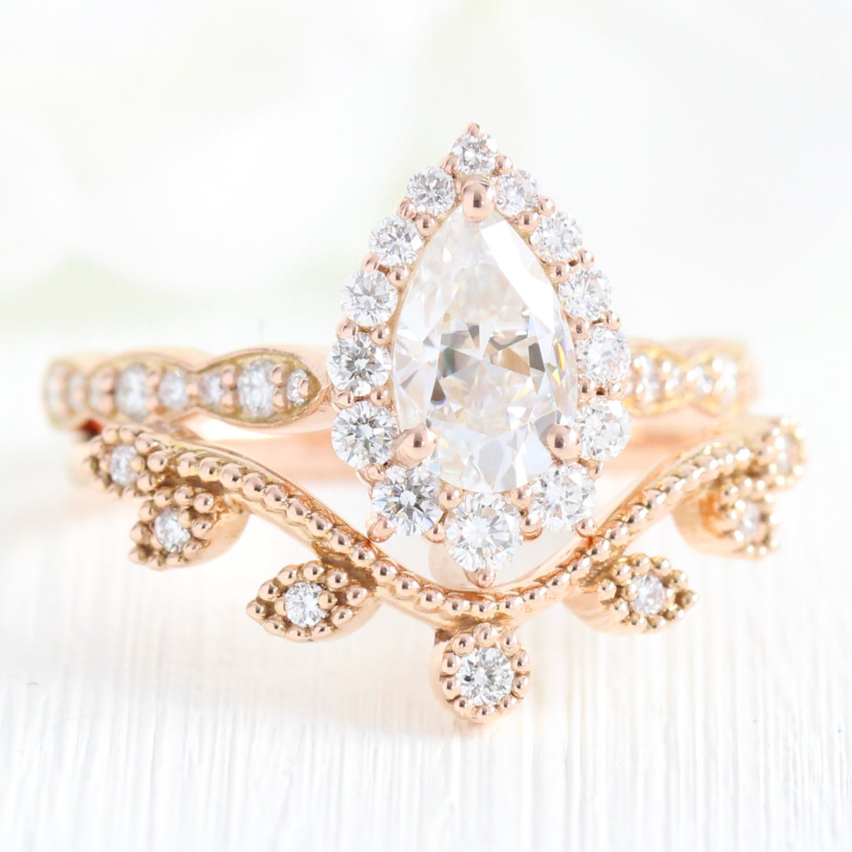 halo diamond pear moissanite engagement ring and curved wedding band la more design jewelry
