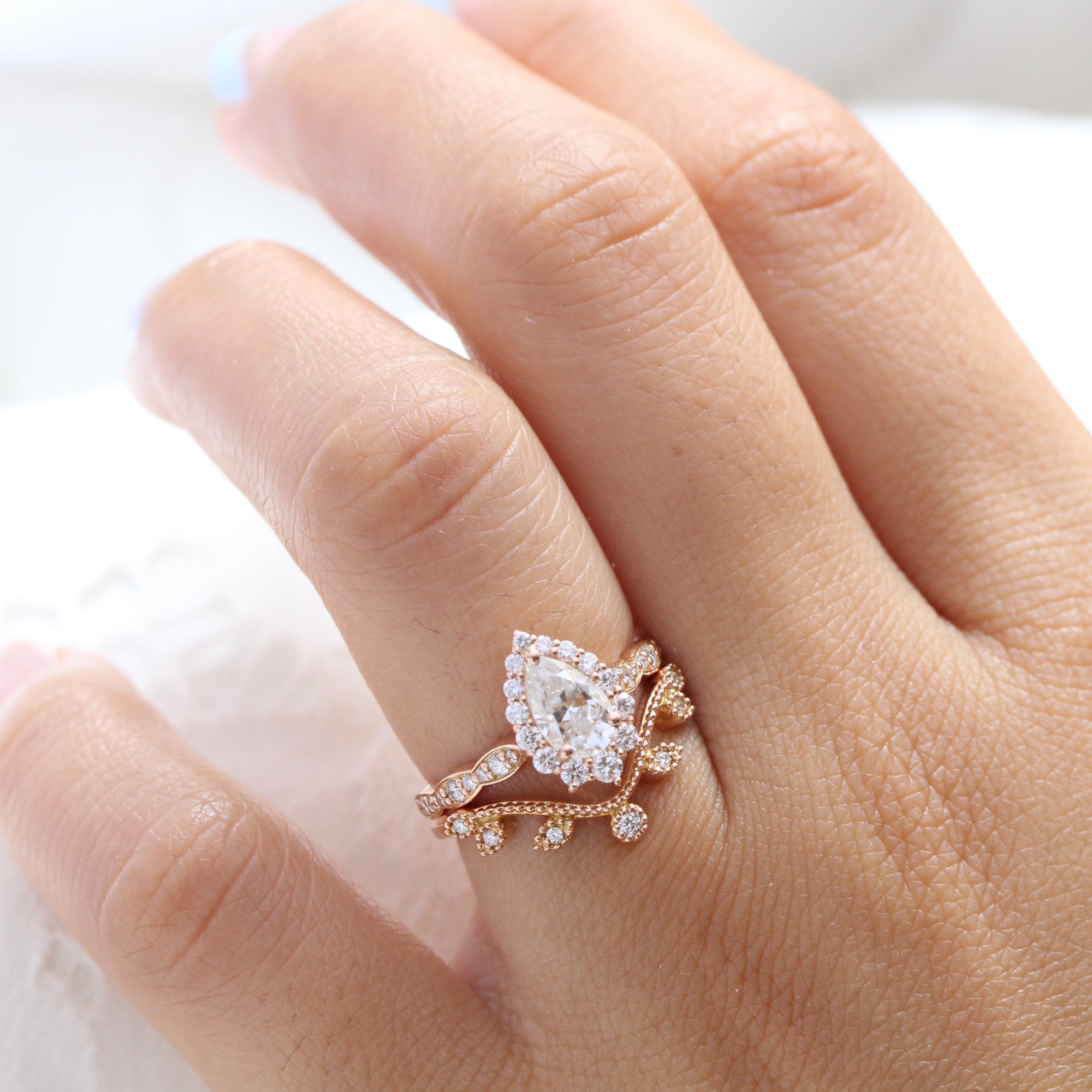 halo diamond pear moissanite engagement ring and curved wedding band la more design jewelry