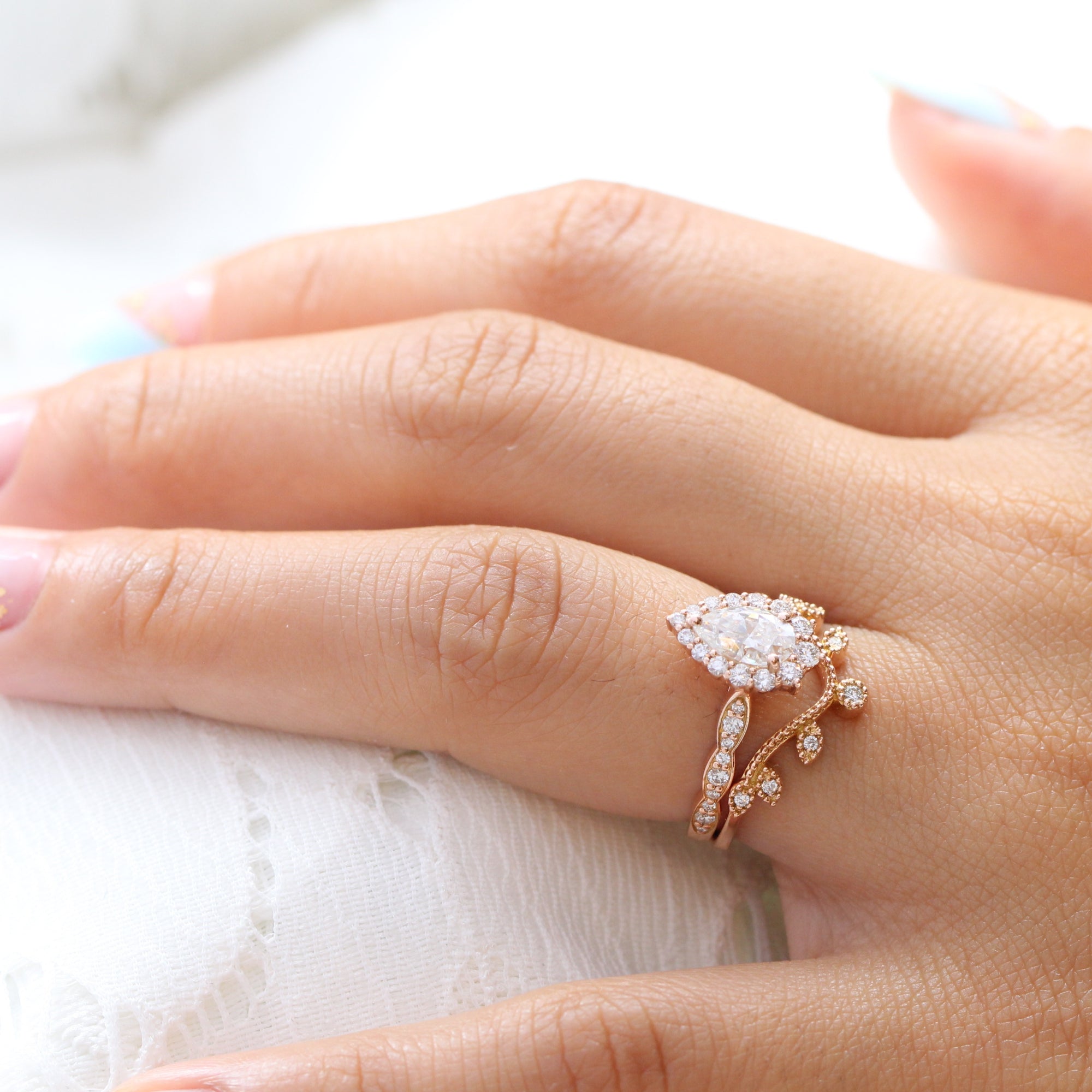 halo diamond pear moissanite engagement ring and curved wedding band la more design jewelry