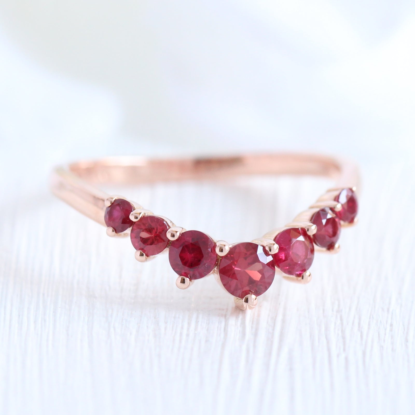 large ruby wedding ring in rose gold half eternity curved wedding band by la more design jewelry