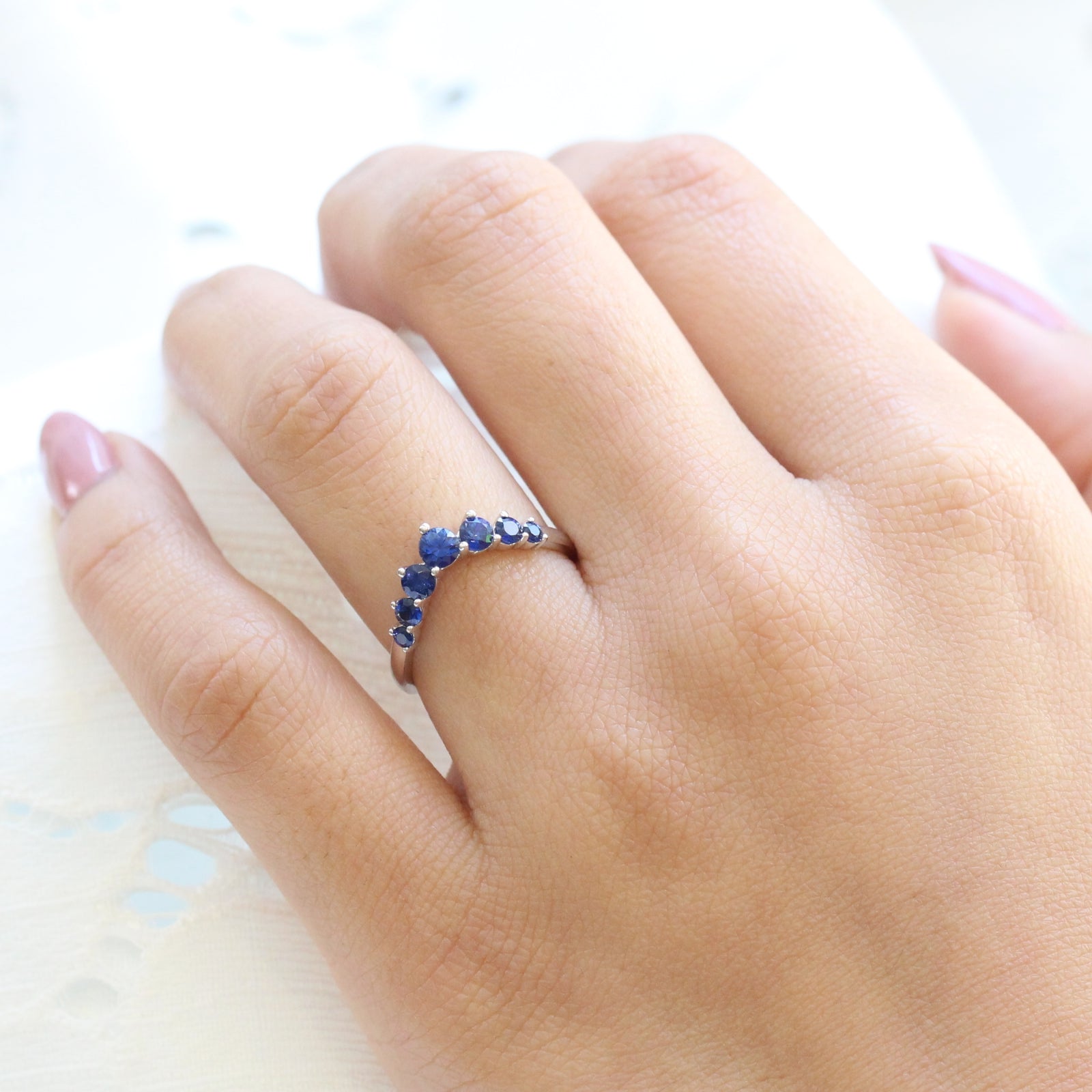 large sapphire wedding band in white gold half eternity curved wedding ring by la more design jewelry