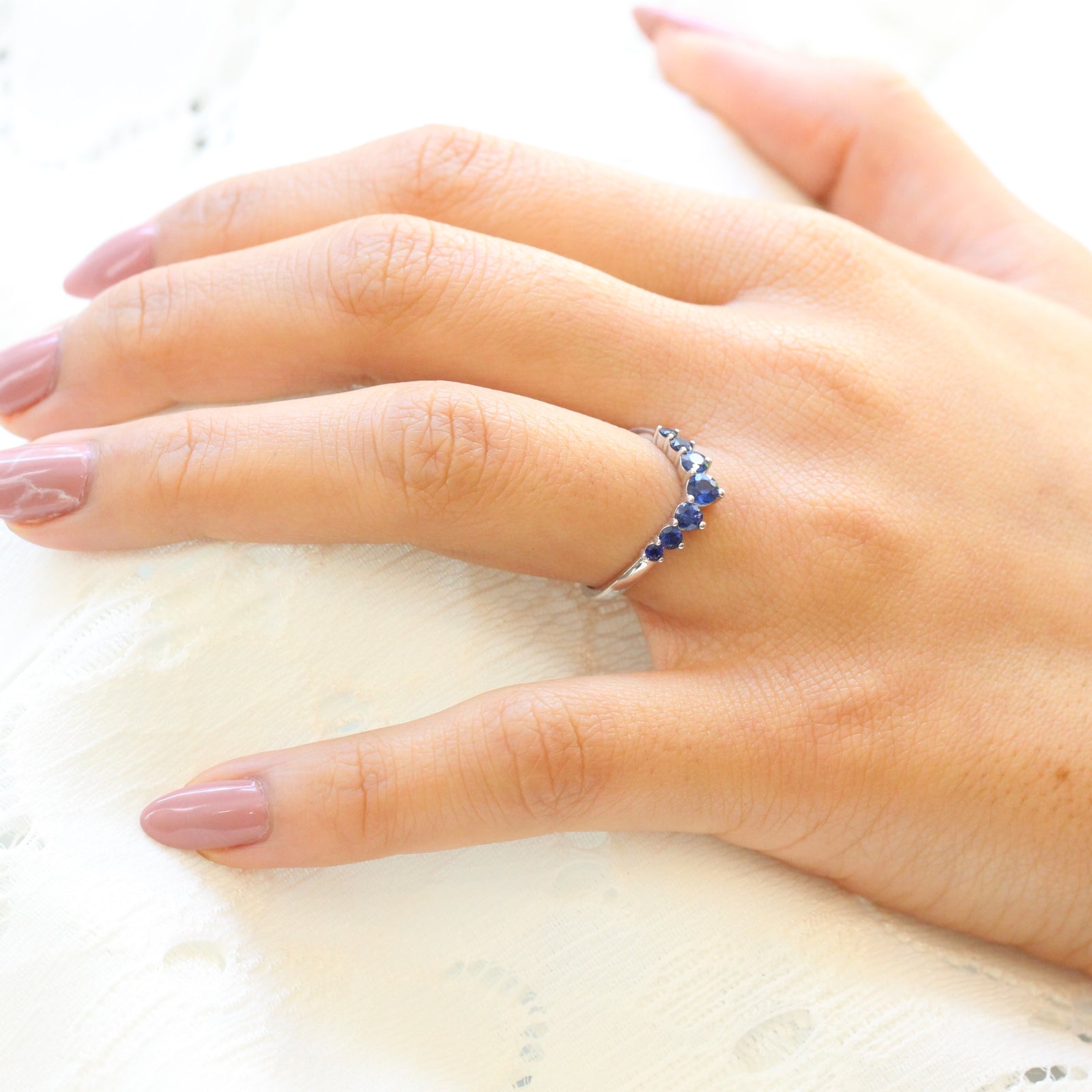 large sapphire wedding band in white gold half eternity curved wedding ring by la more design jewelry