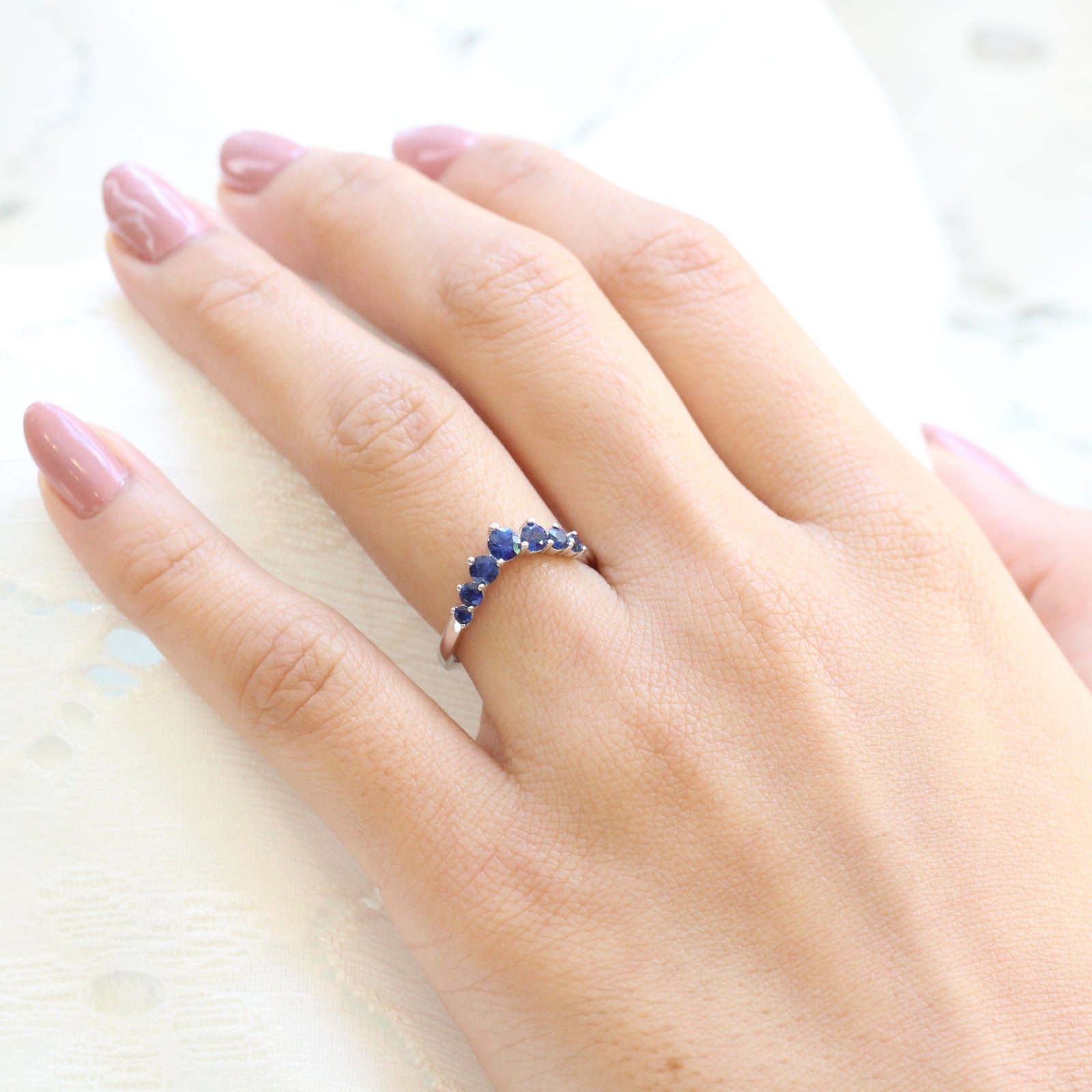 large sapphire wedding band in white gold half eternity curved wedding ring by la more design jewelry