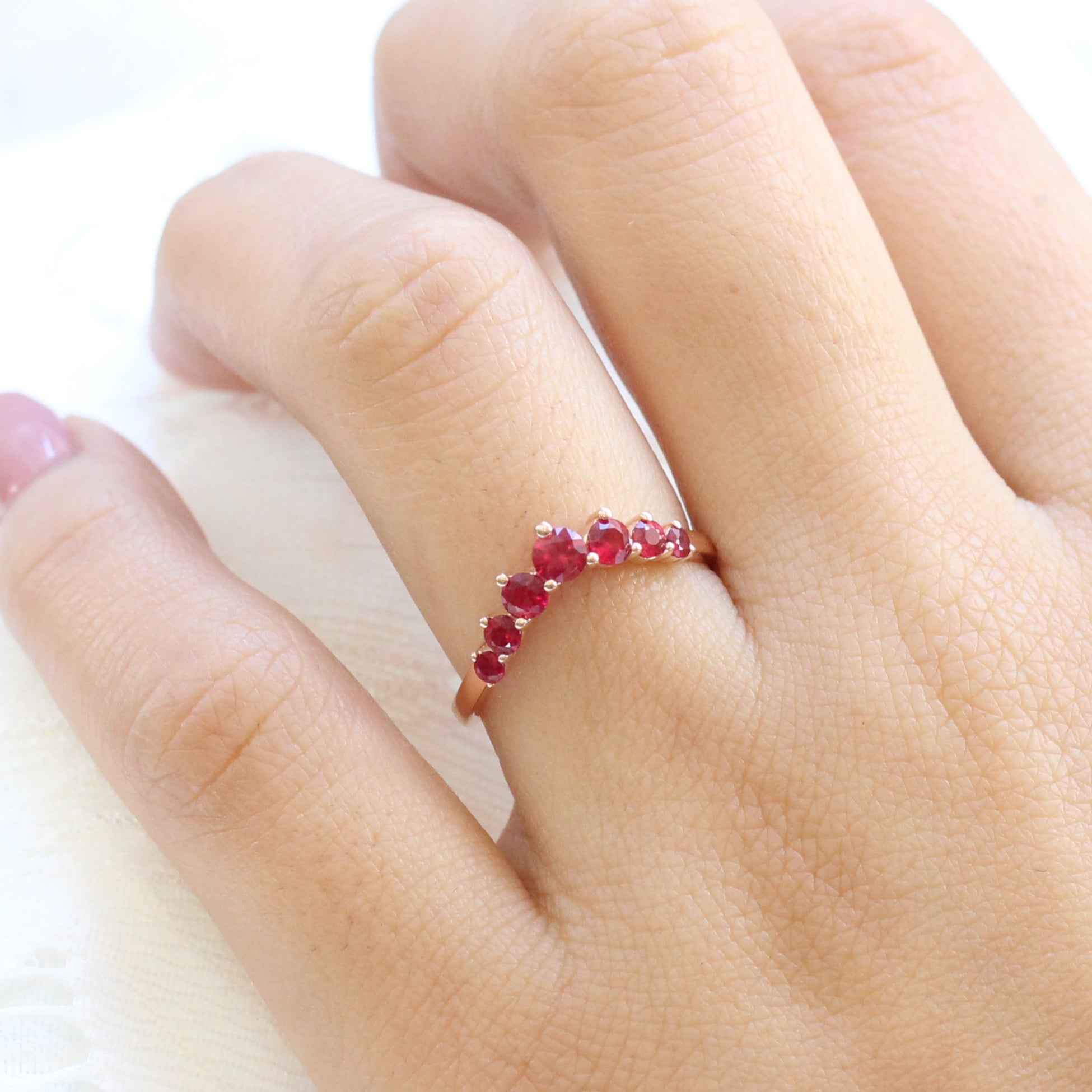 large ruby wedding ring in rose gold half eternity curved wedding band by la more design jewelry