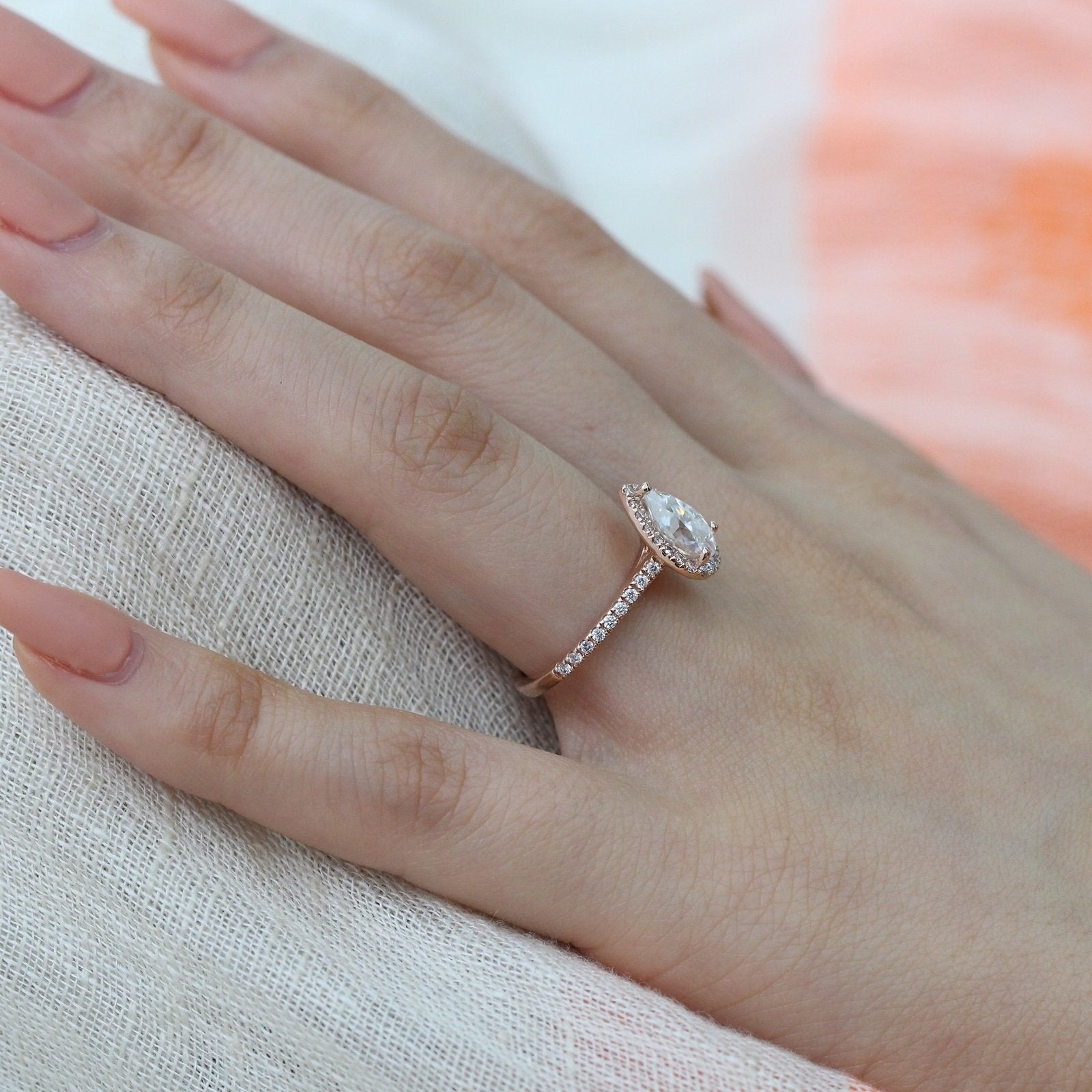 rose gold pear moissanite halo diamond engagement ring by la more design