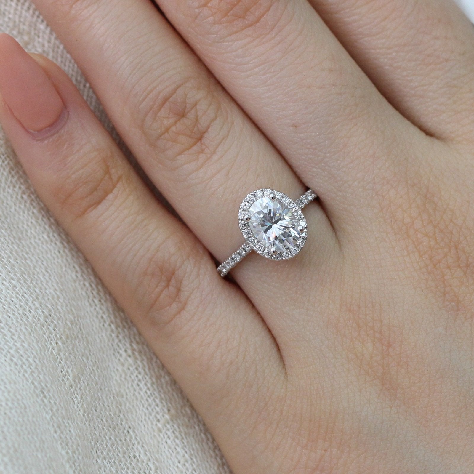 white gold oval moissanite halo diamond engagement ring by la more design