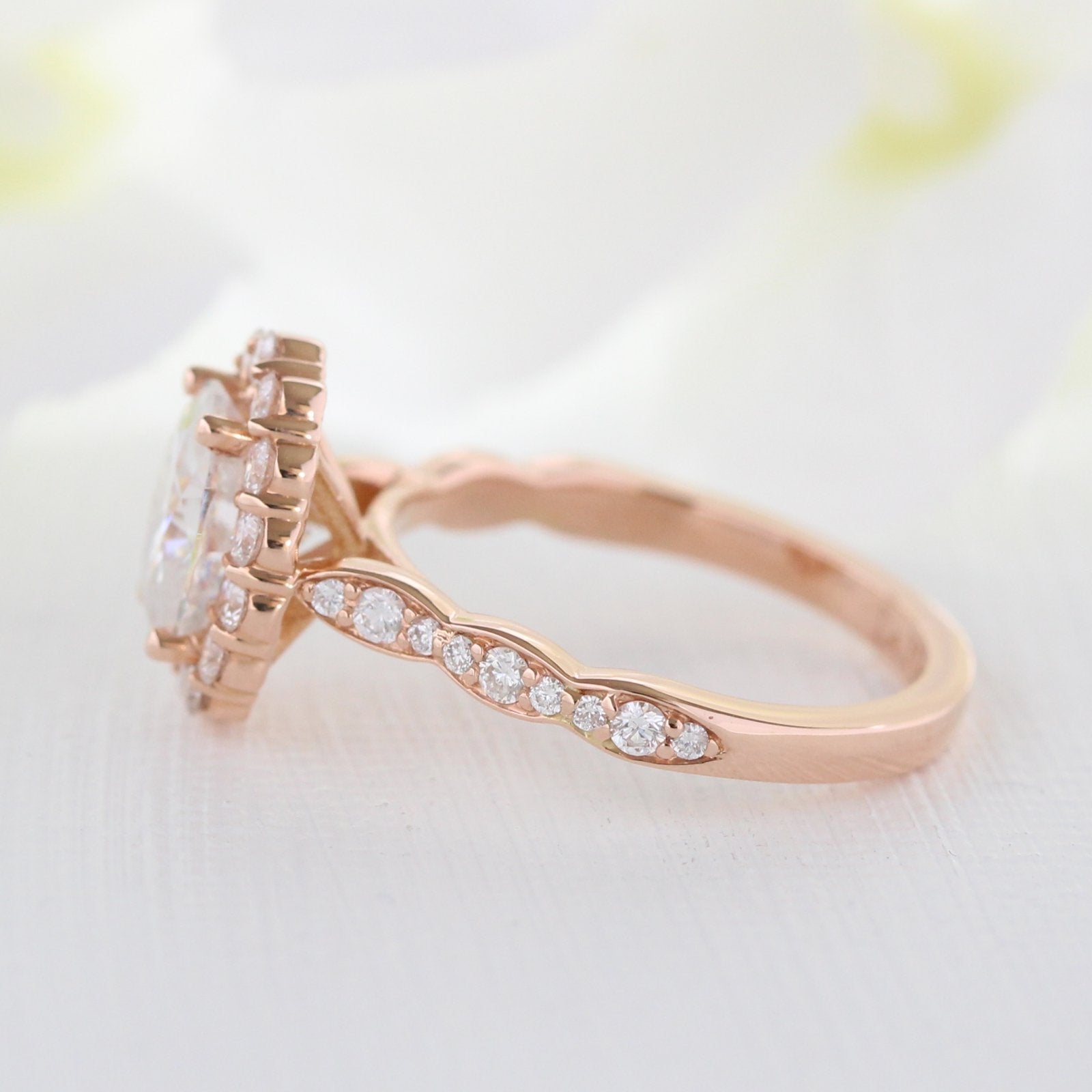 oval moissanite engagement ring in rose gold halo diamond ring by la more design