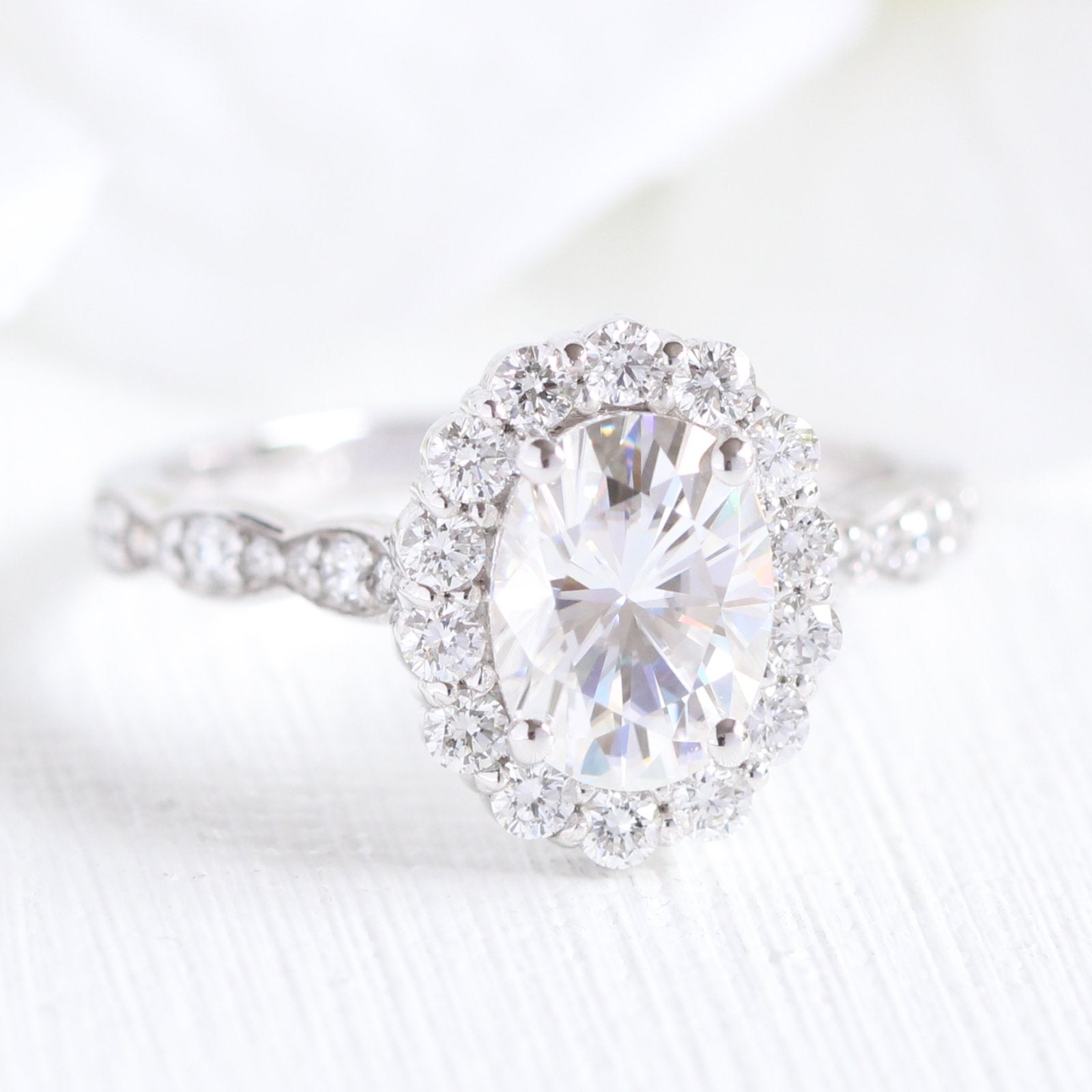 oval moissanite engagement ring in white gold halo diamond ring by la more design