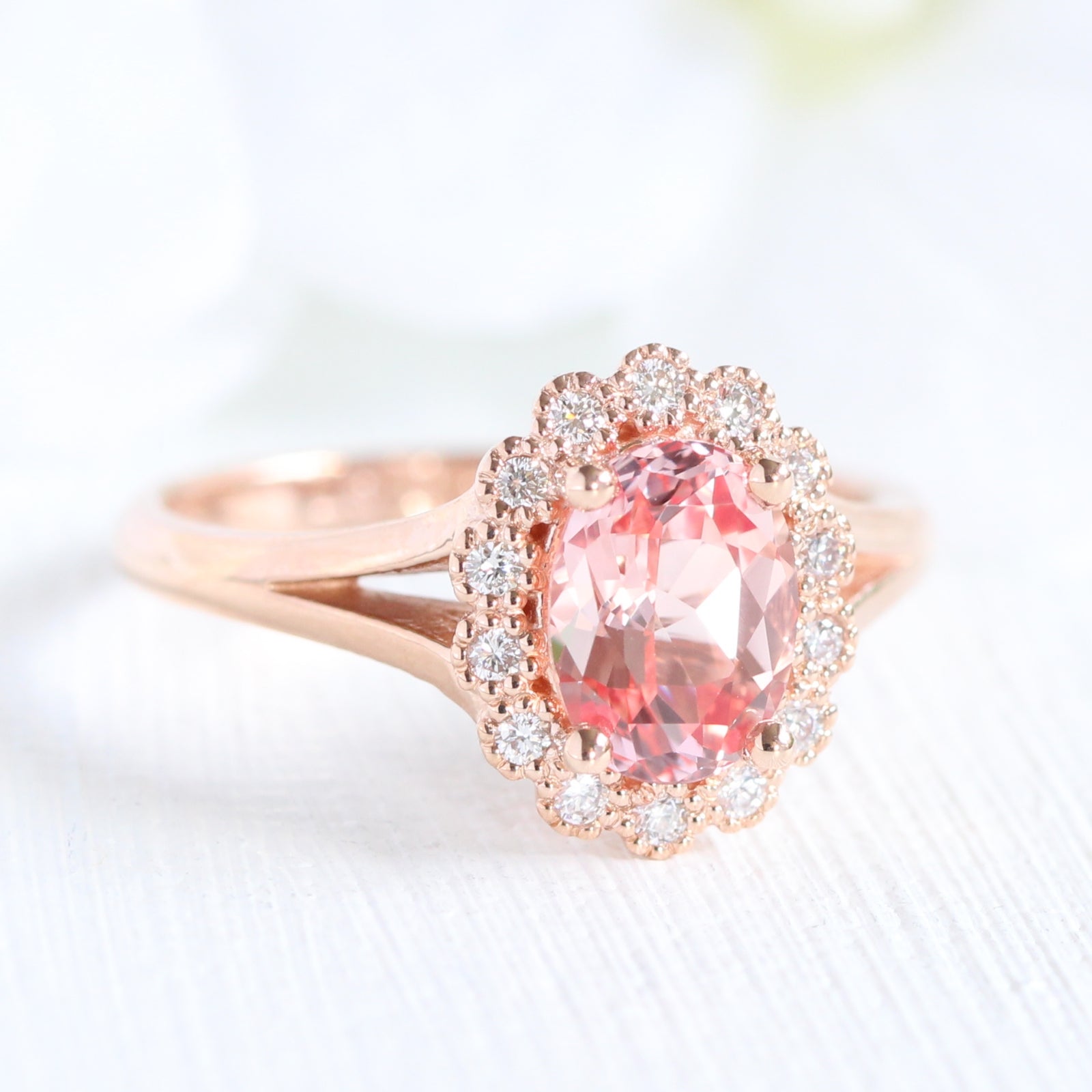 oval peach sapphire engagement ring in rose gold halo diamond band by la more design