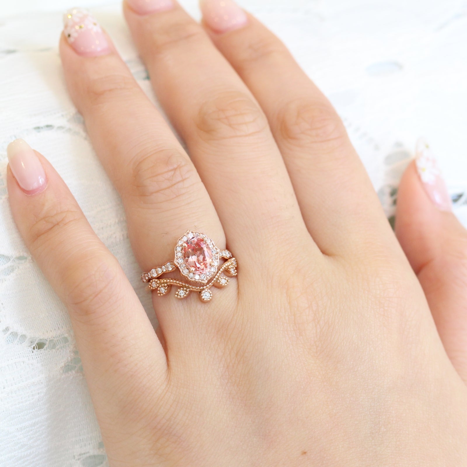 oval peach sapphire ring and curved leaf diamond band bridal set in rose gold by la more design