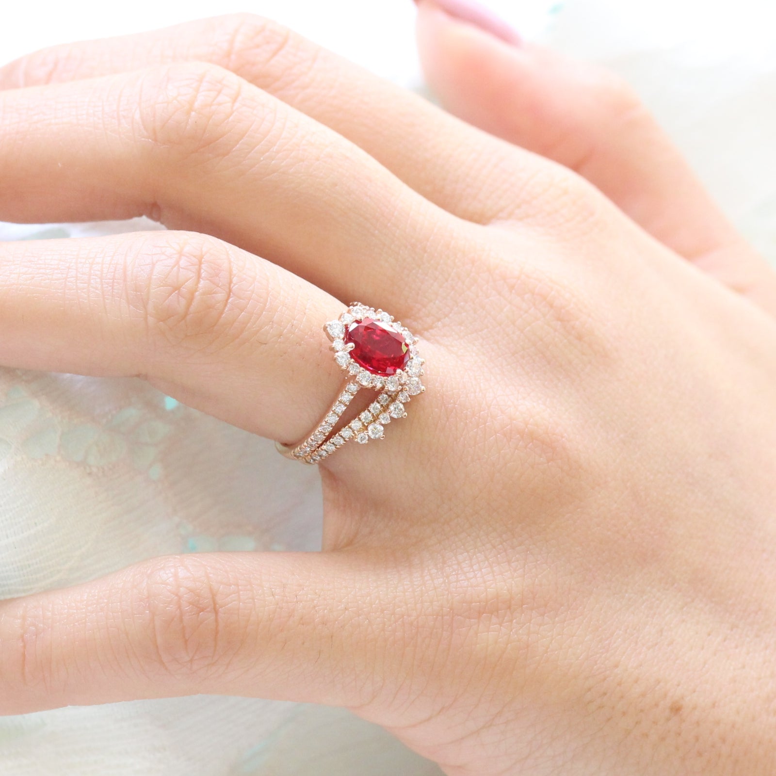 oval ruby engagement ring rose gold halo diamond bridal set and crown diamond wedding band by la more design jewelry