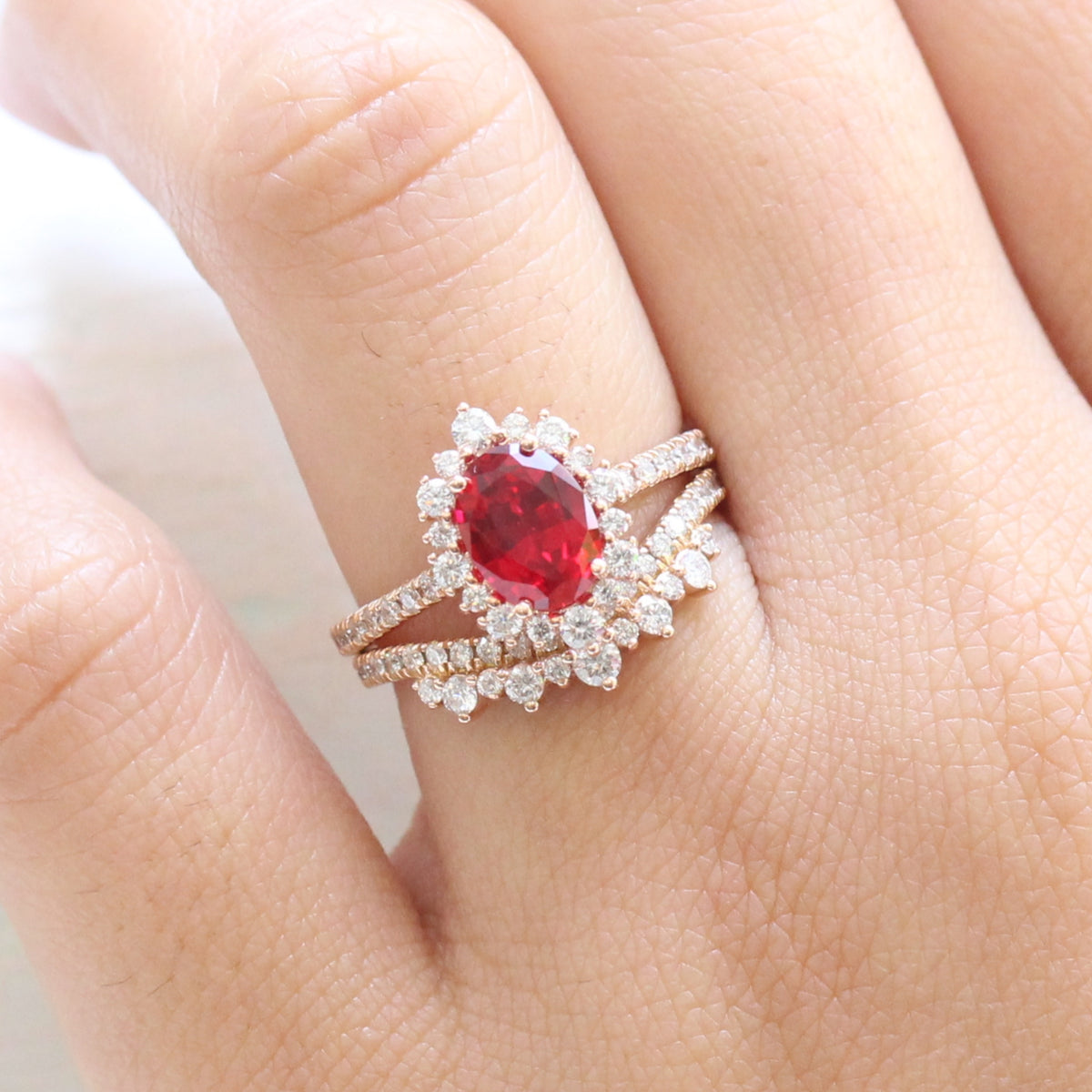 oval ruby engagement ring rose gold halo diamond bridal set and crown diamond wedding band by la more design jewelry