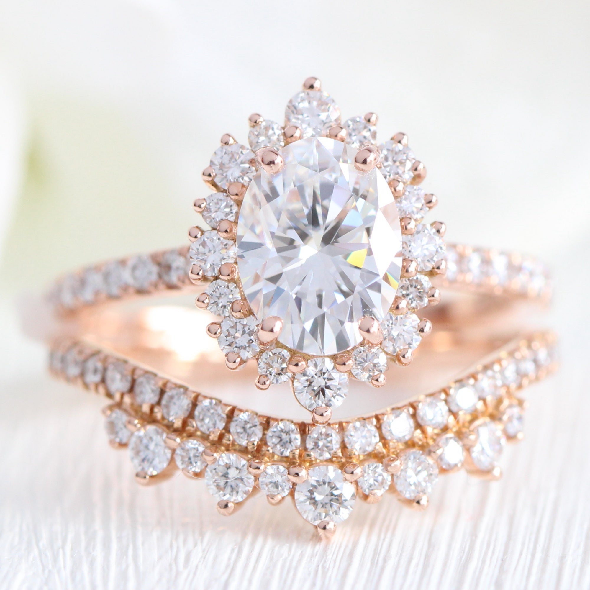 oval moissanite engagement ring halo diamond bridal set rose gold and crown diamond wedding band by la more design jewelry