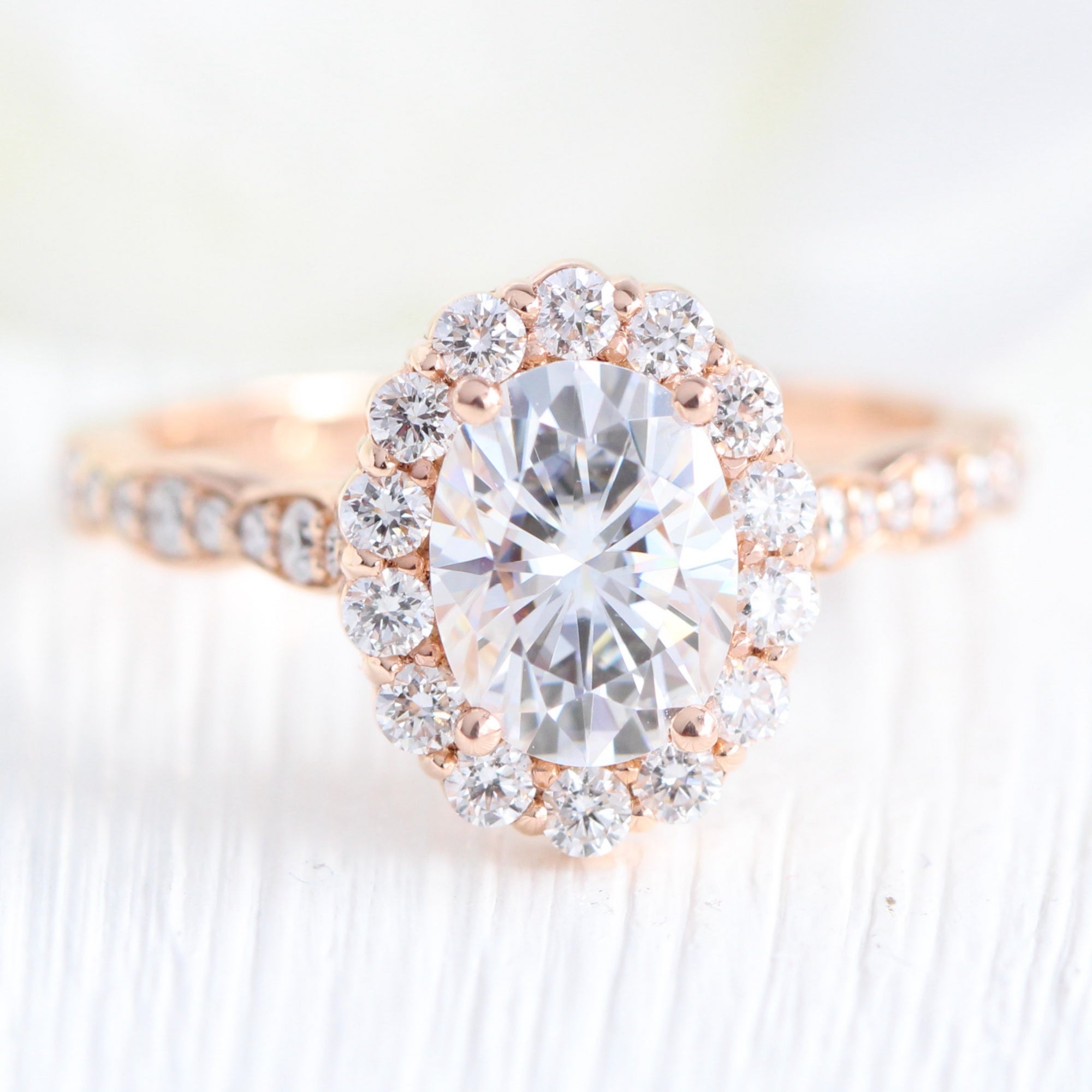 oval moissanite engagement ring in rose gold halo diamond ring by la more design jewelry