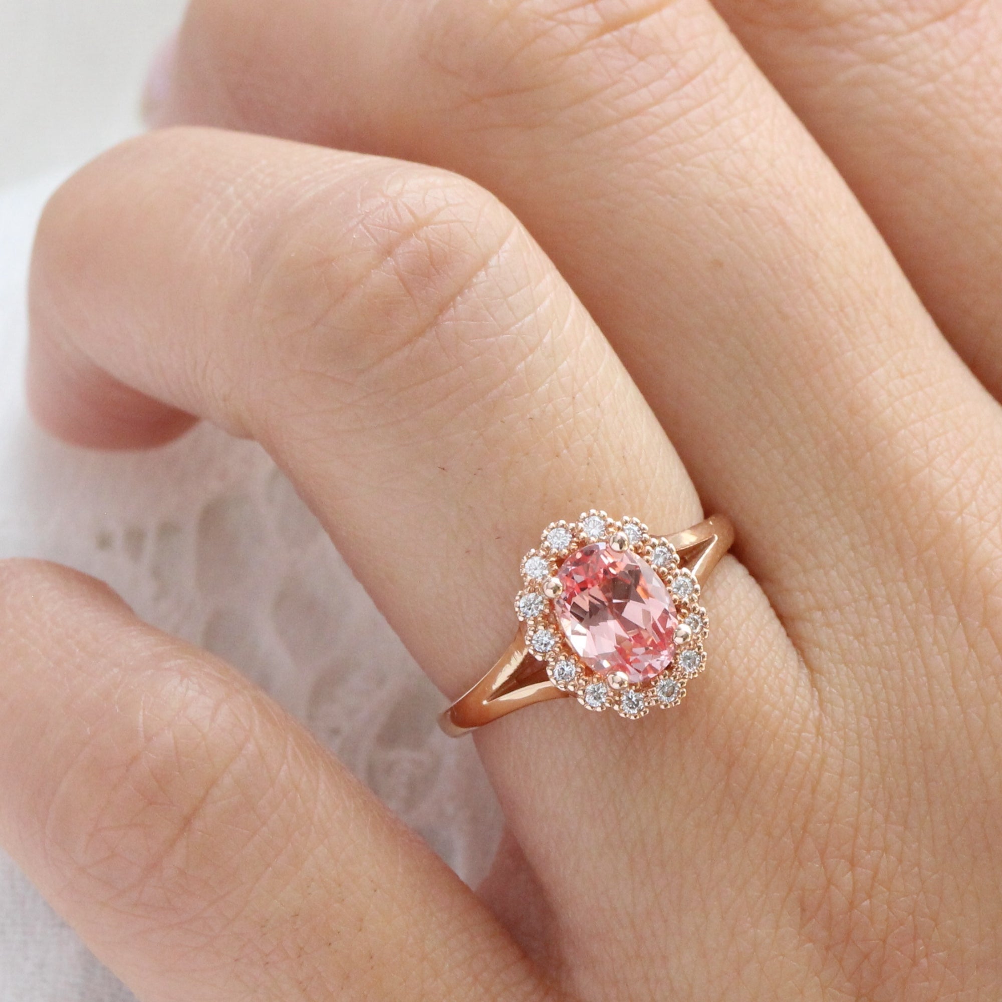 oval peach sapphire engagement ring in rose gold halo diamond band by la more design jewelry