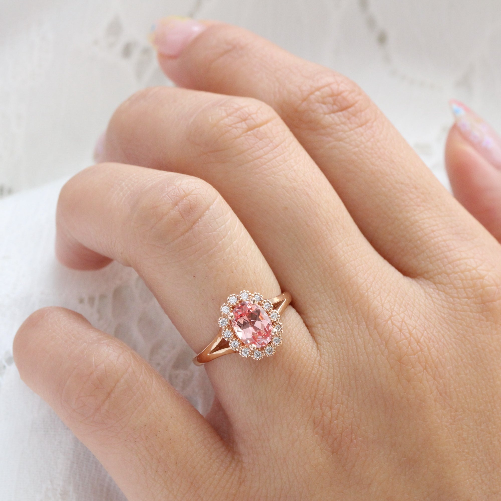 oval peach sapphire engagement ring in rose gold halo diamond band by la more design jewelry