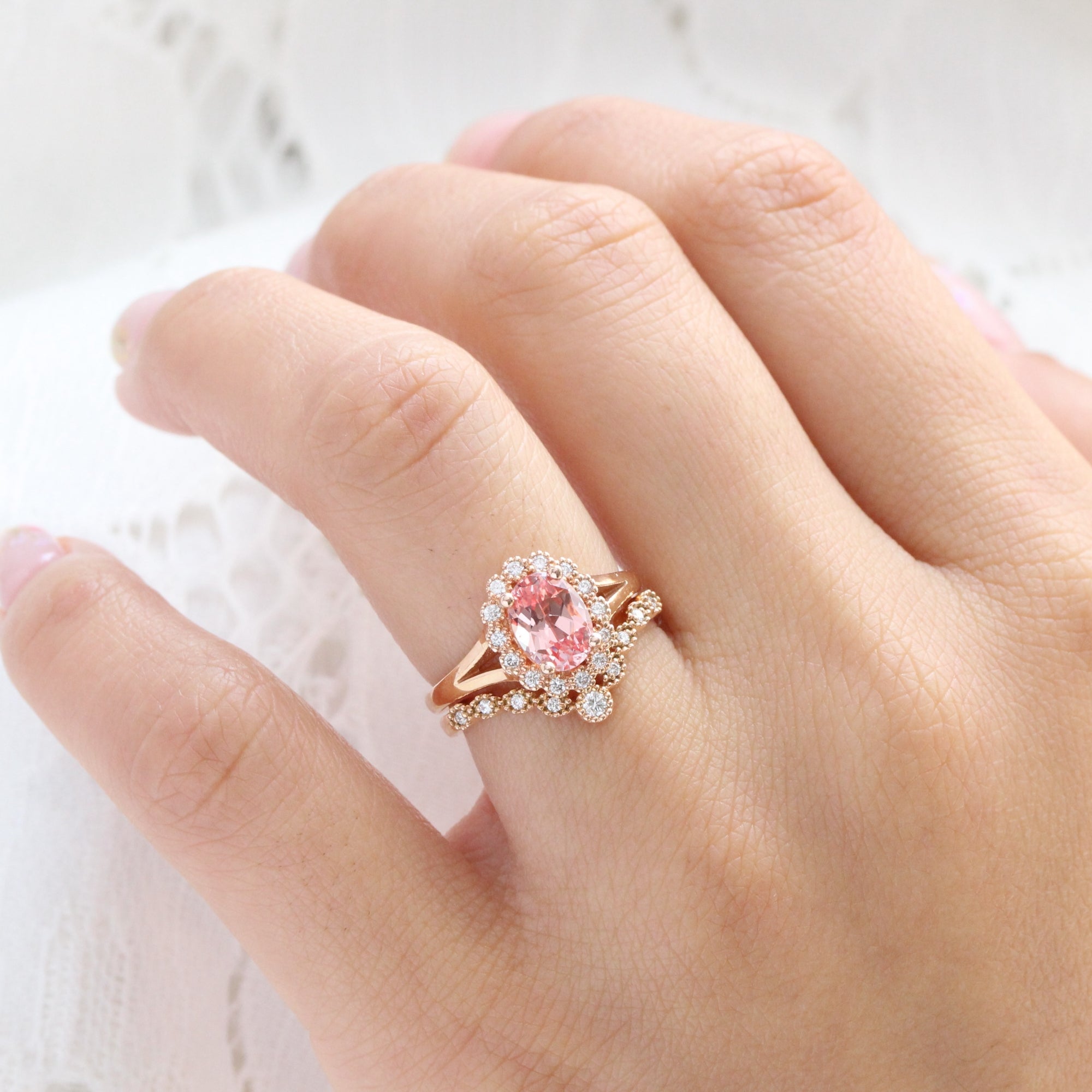 oval peach sapphire ring and curved diamond band bridal set in rose gold by la more design