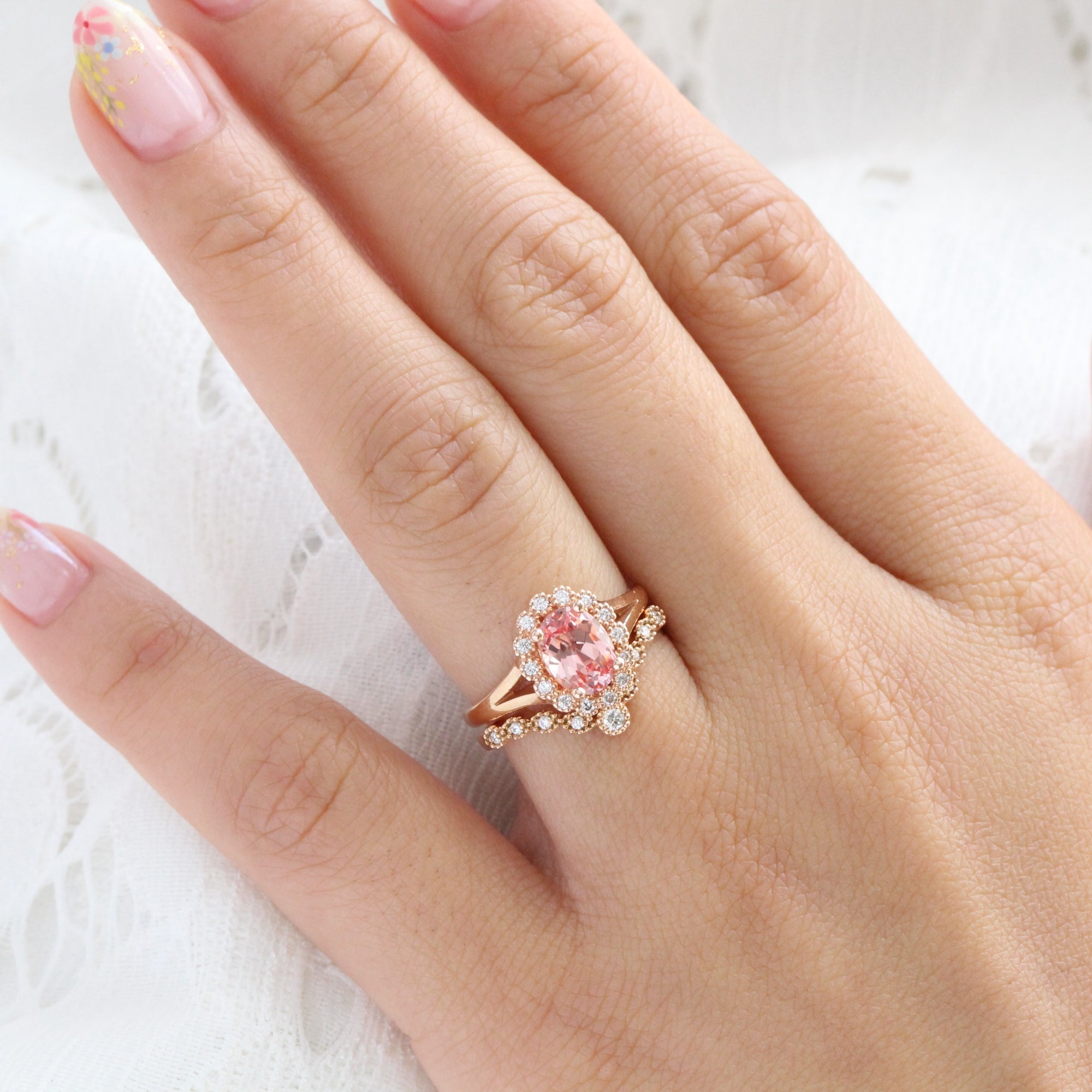 oval peach sapphire ring and curved diamond band bridal set in rose gold by la more design