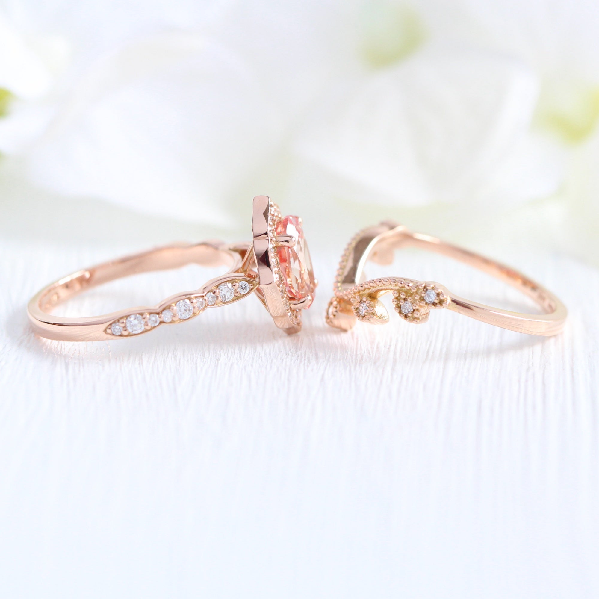 oval peach sapphire ring and curved diamond band in rose gold bridal set by la more design