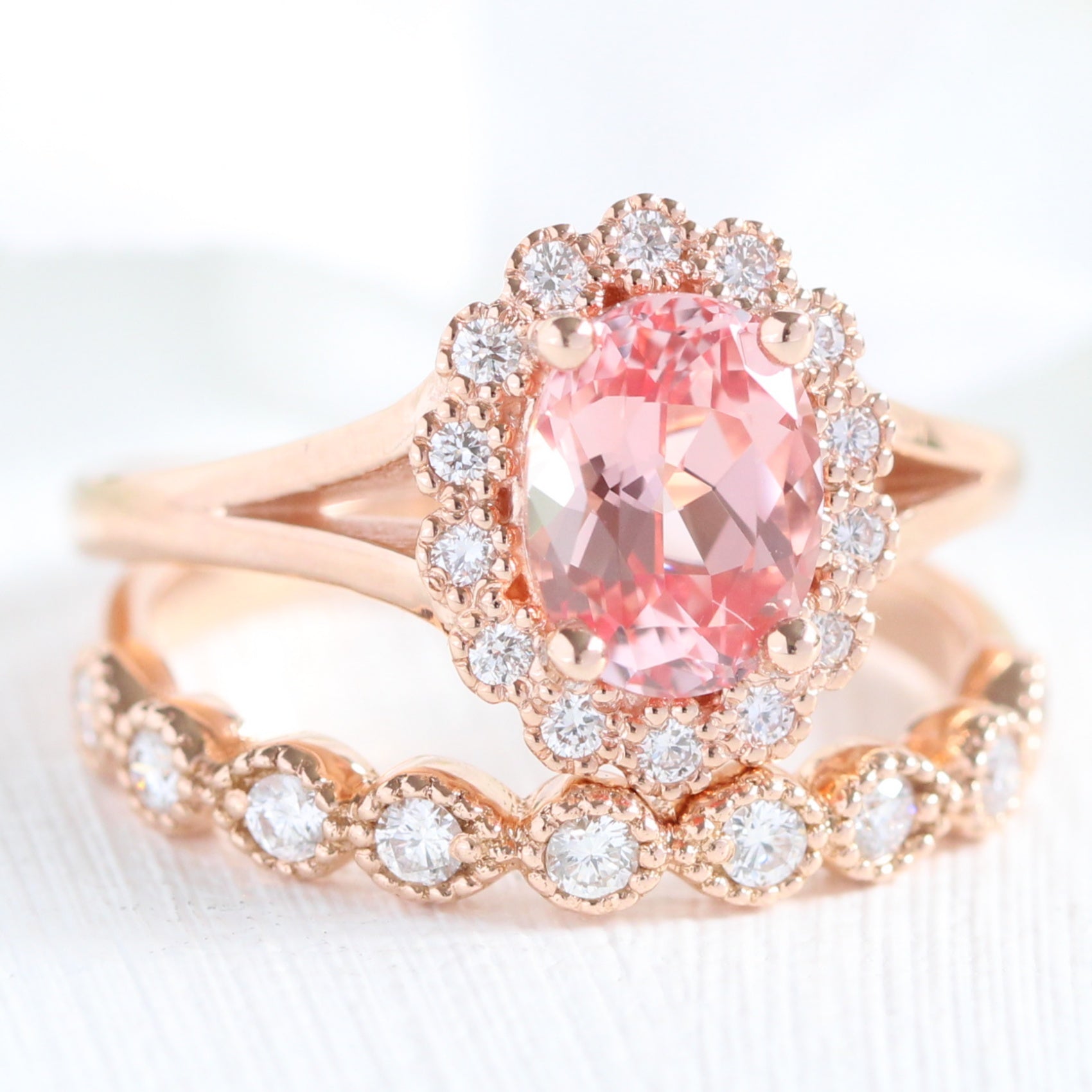 oval peach sapphire ring and milgrain diamond band in rose gold bridal set by la more design