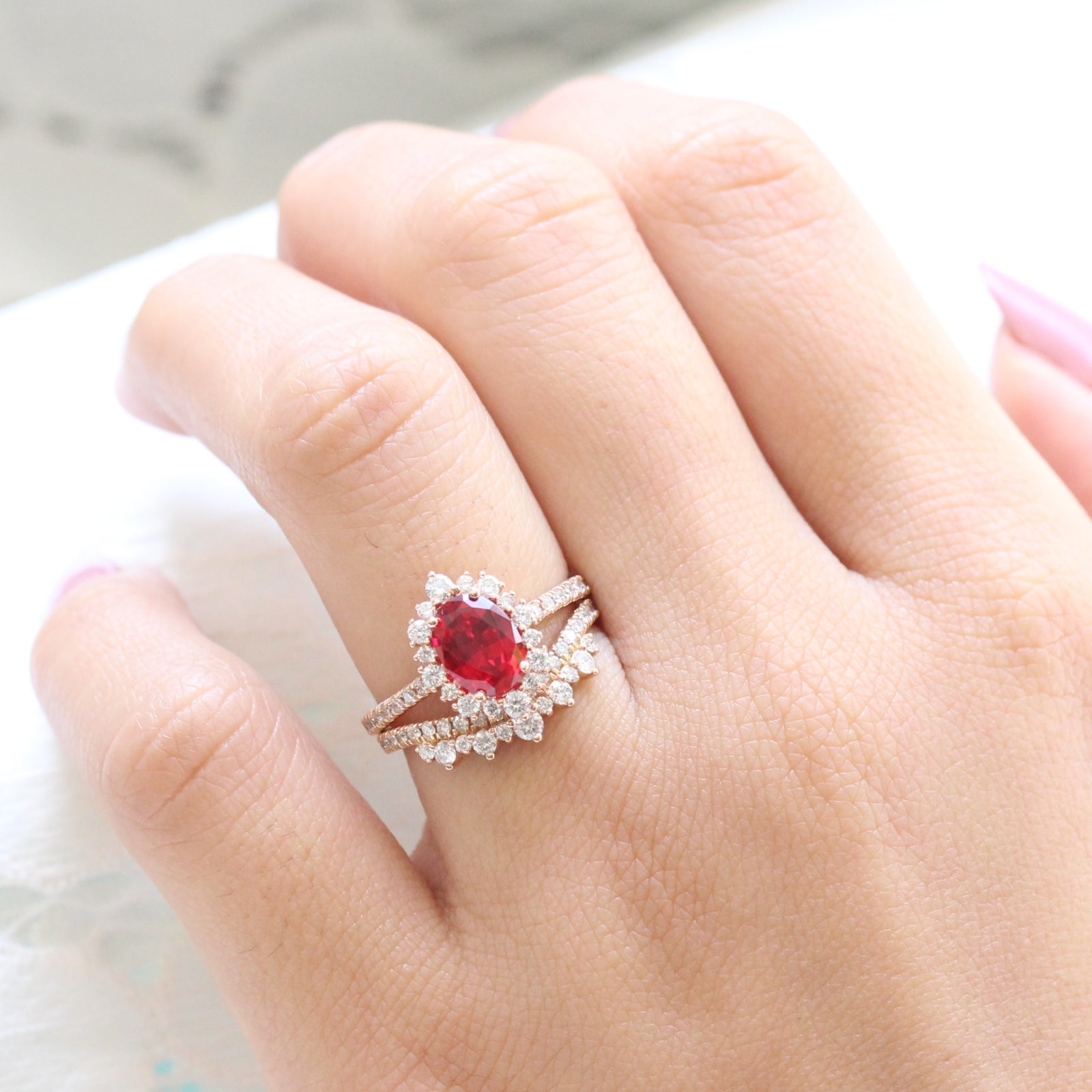oval ruby engagement ring rose gold halo diamond bridal set and crown diamond wedding band by la more design jewelry