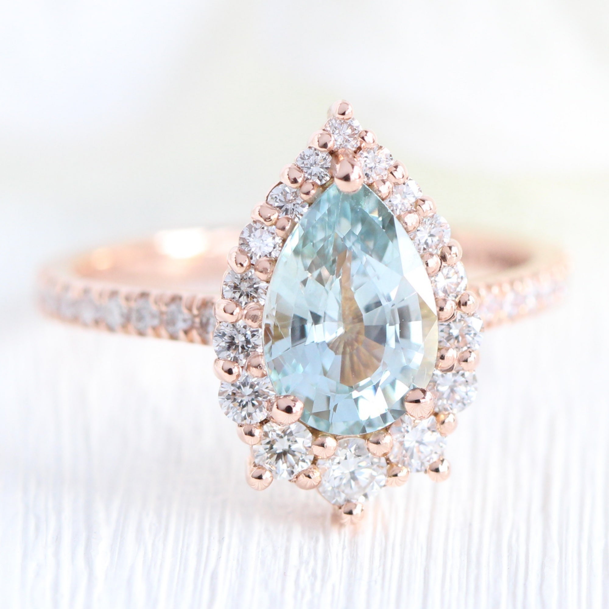 pastel blue sapphire ring rose gold halo diamond pear engagement ring la more design jewelry