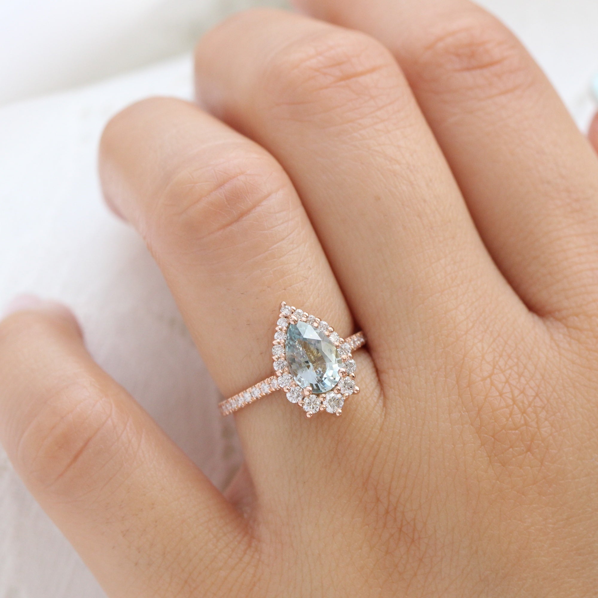 pastel blue sapphire ring rose gold halo diamond pear engagement ring la more design jewelry