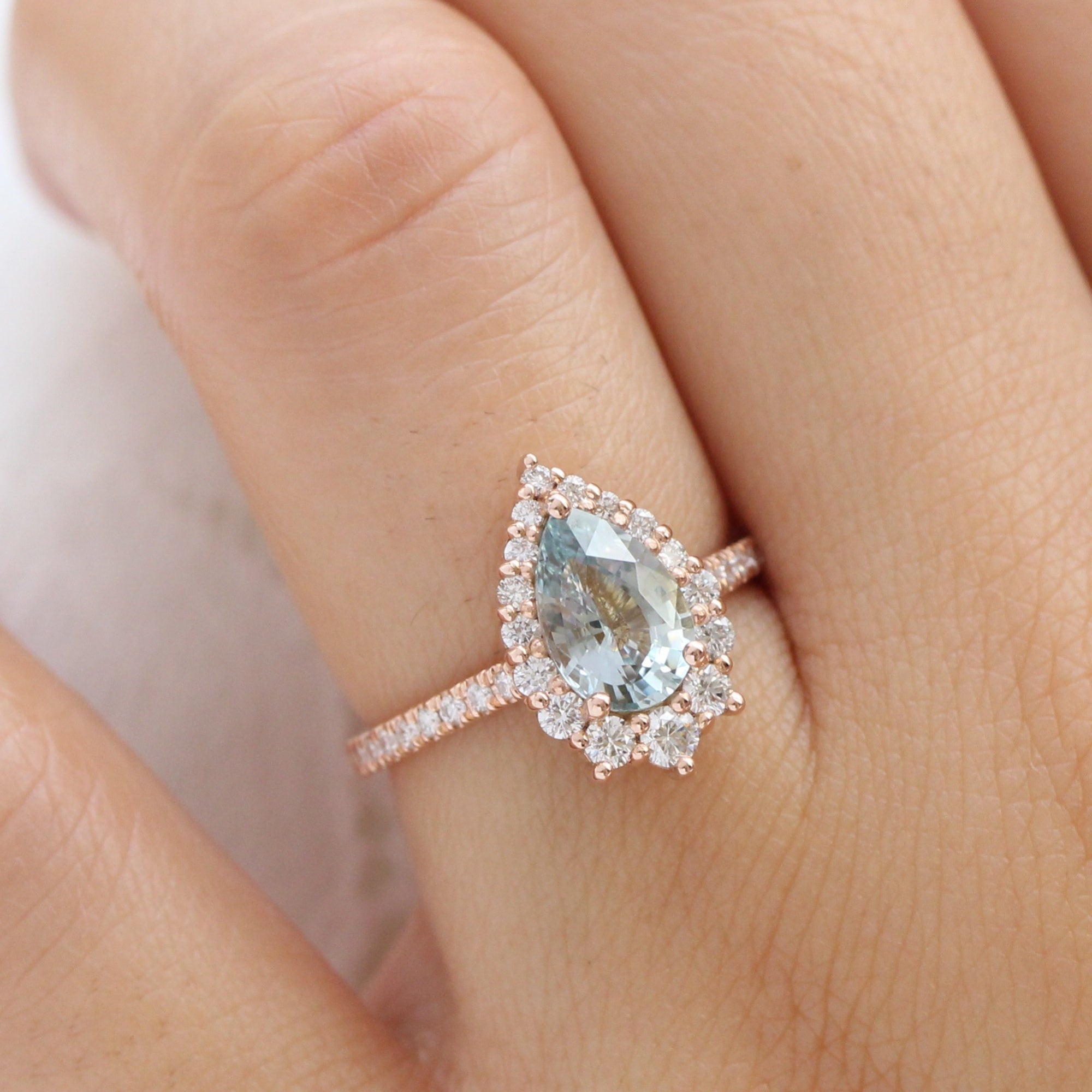 pastel blue sapphire ring rose gold halo diamond pear engagement ring la more design jewelry