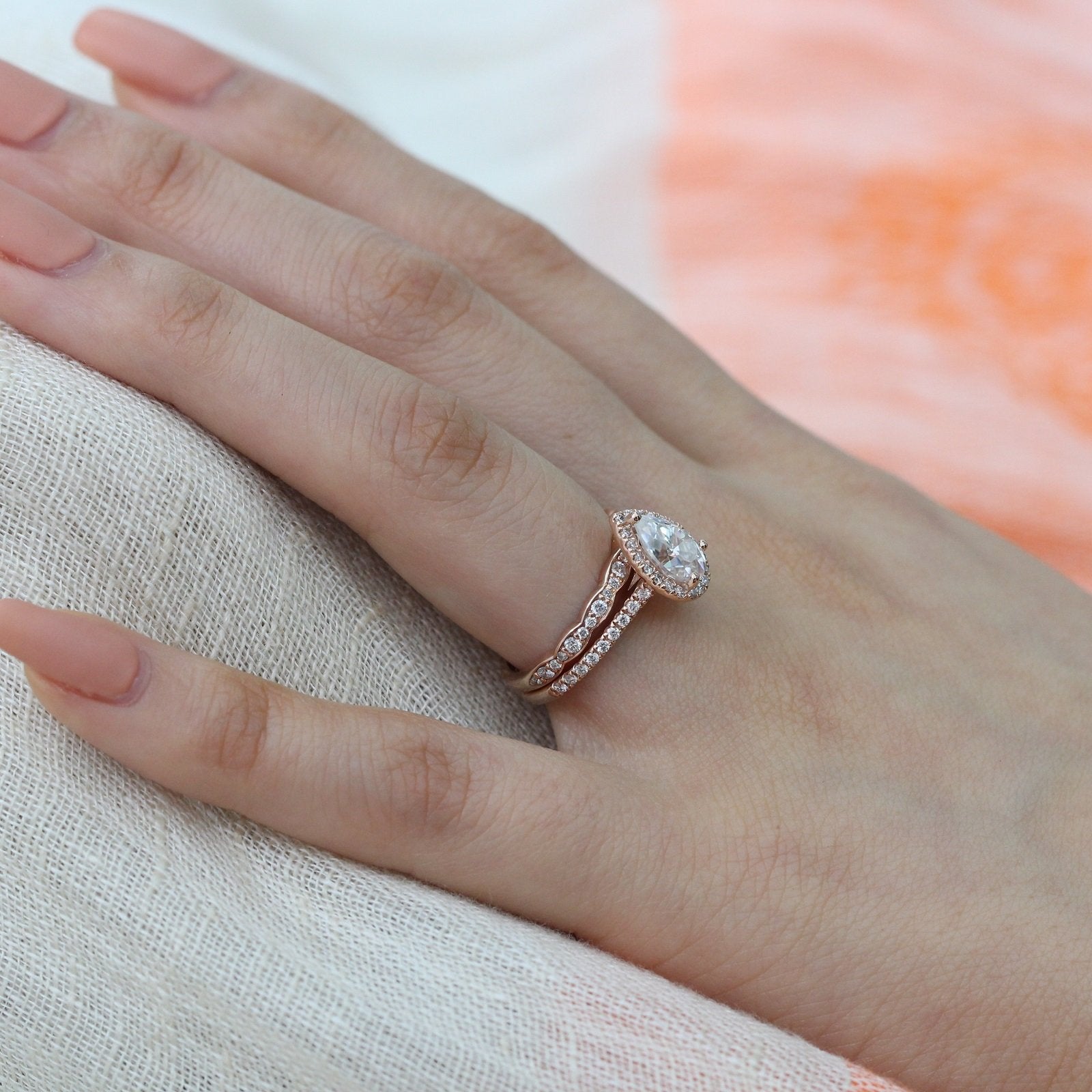 pear moissanite engagement ring scalloped diamond wedding band set rose gold by la more design