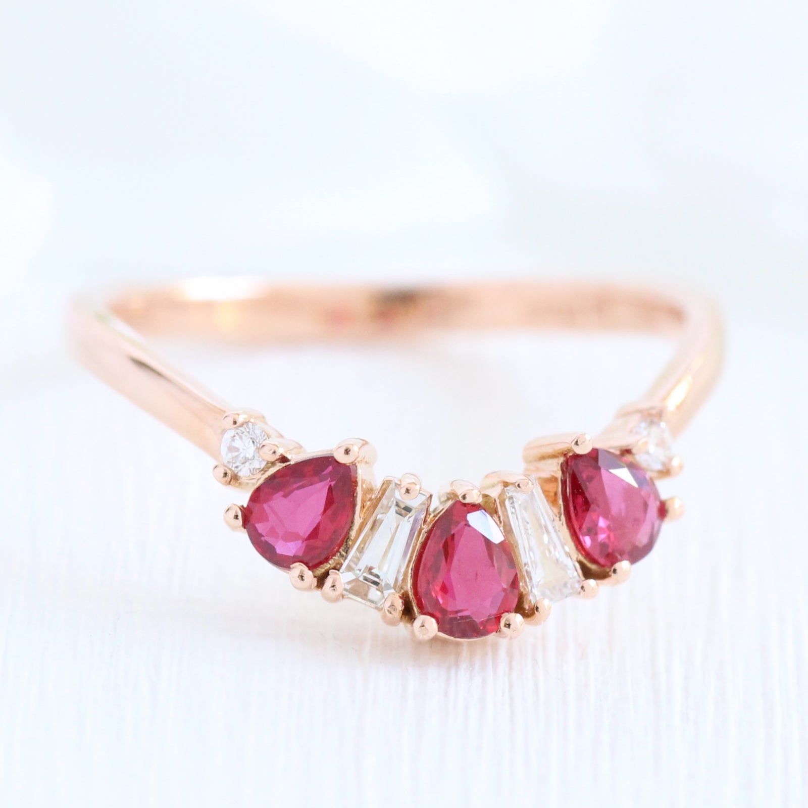 pear and baguette diamond and ruby ring rose gold curved wedding band by la more design jewelry