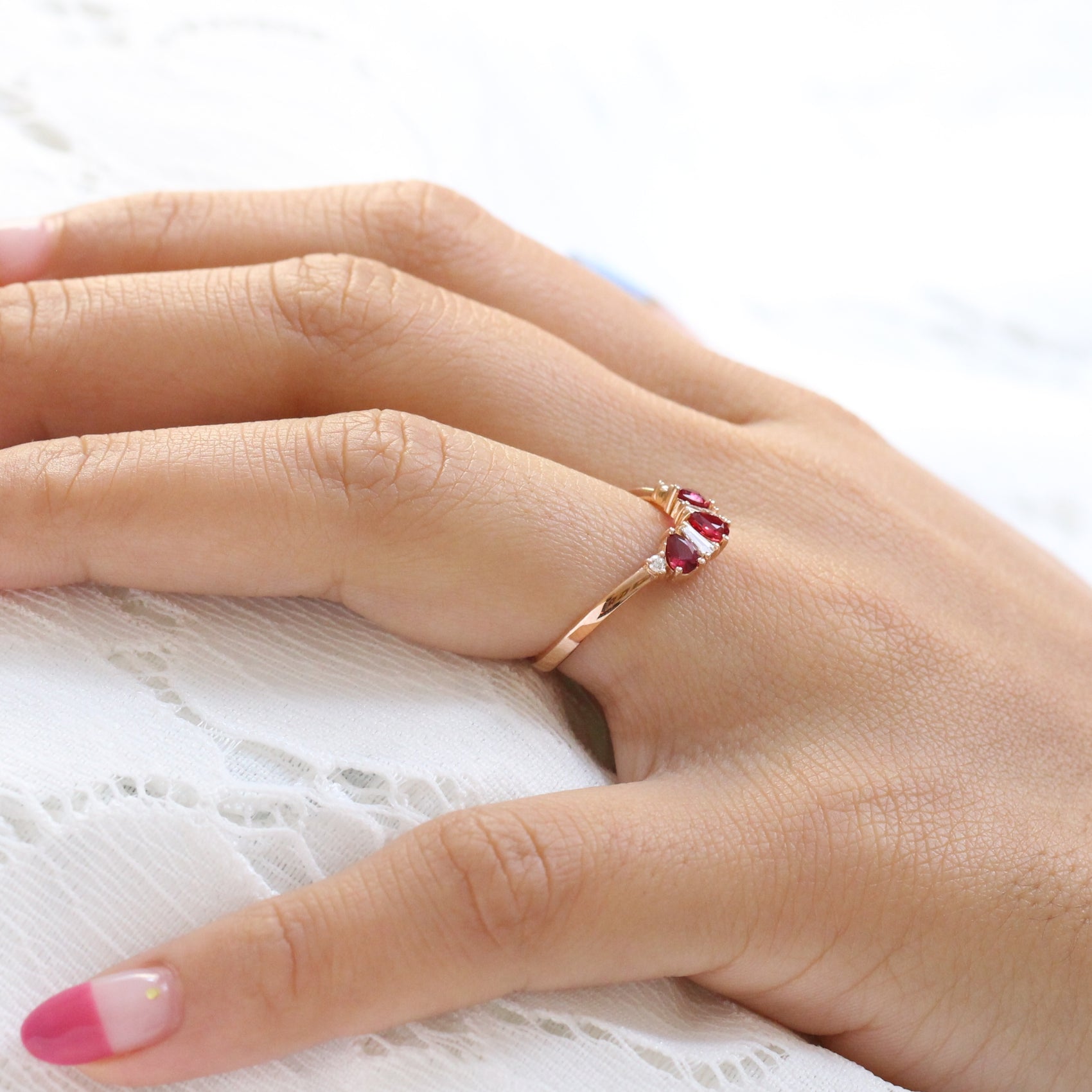 pear and baguette diamond and ruby ring rose gold curved wedding band by la more design jewelry