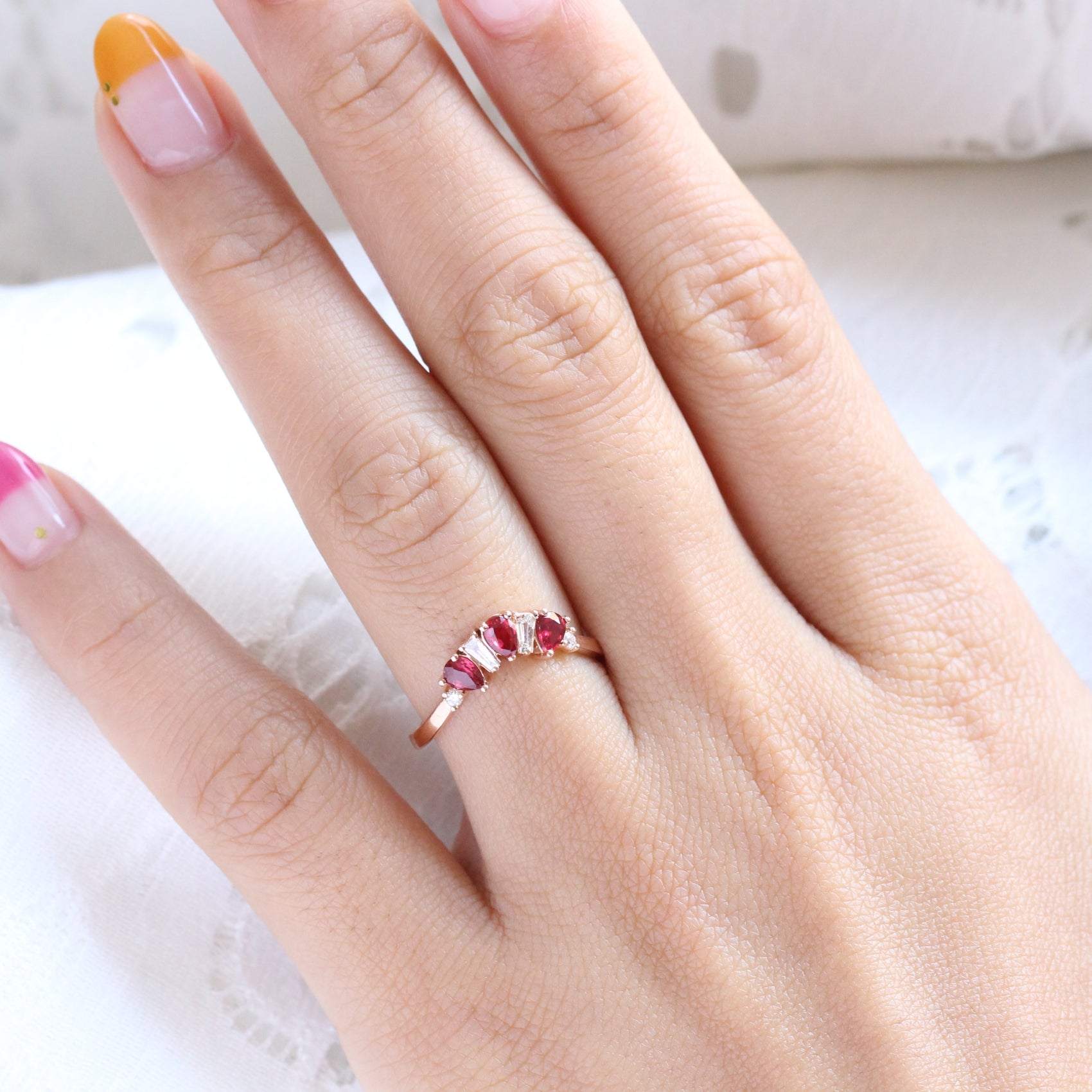 pear and baguette diamond and ruby ring rose gold curved wedding band by la more design jewelry
